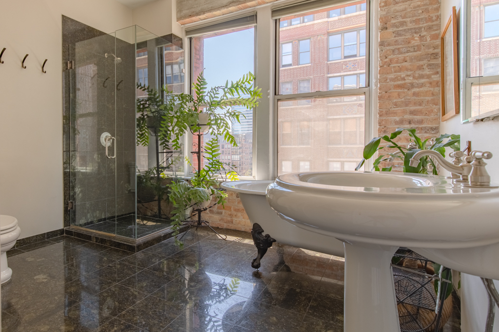 727 South Dearborn Street, Unit 910 Chicago, IL 60605 - Photo 15 of 37 a room with a large window and chair
