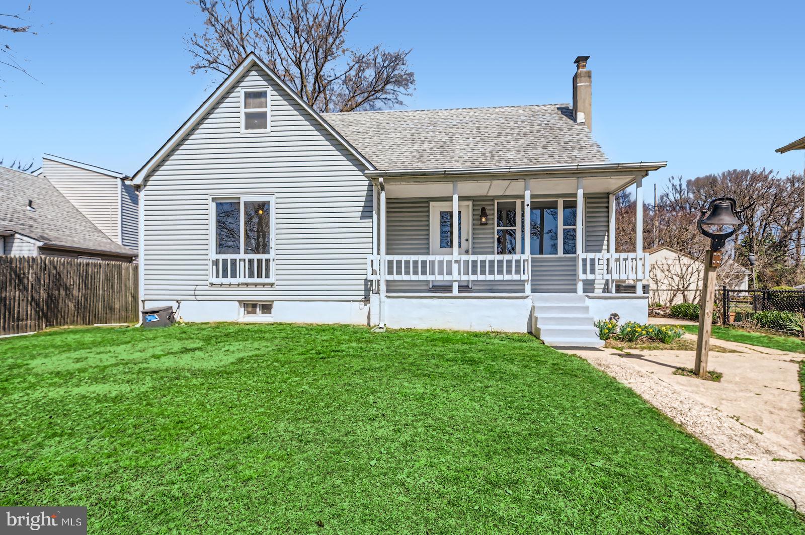 1004 Thompson Boulevard Baltimore, MD 21221 - Photo 11 of 48 a front view of a house with a yard