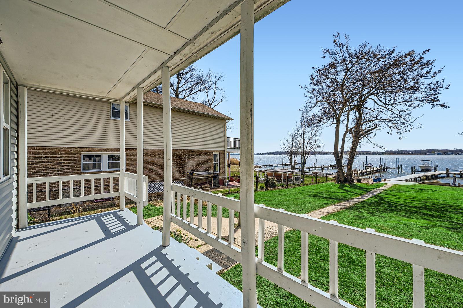1004 Thompson Boulevard Baltimore, MD 21221 - Photo 12 of 48 Covered front porch overlooking serene water views