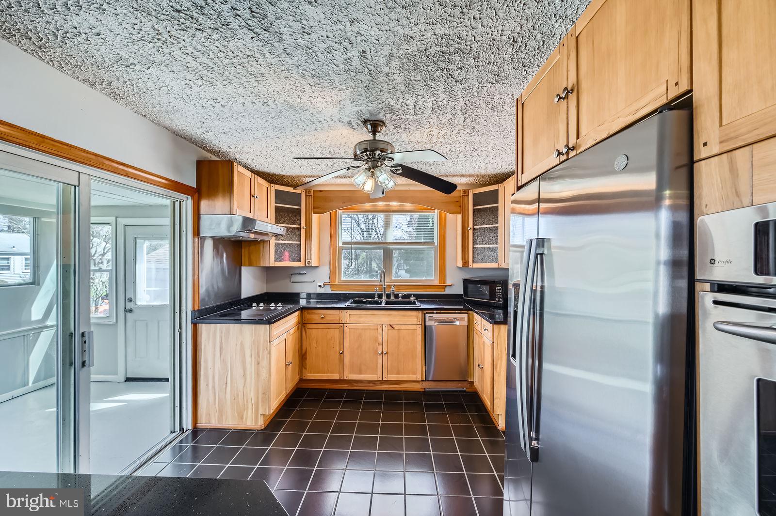 1004 Thompson Boulevard Baltimore, MD 21221 - Photo 24 of 48 kitchen with eat in area & expansion into sunroom