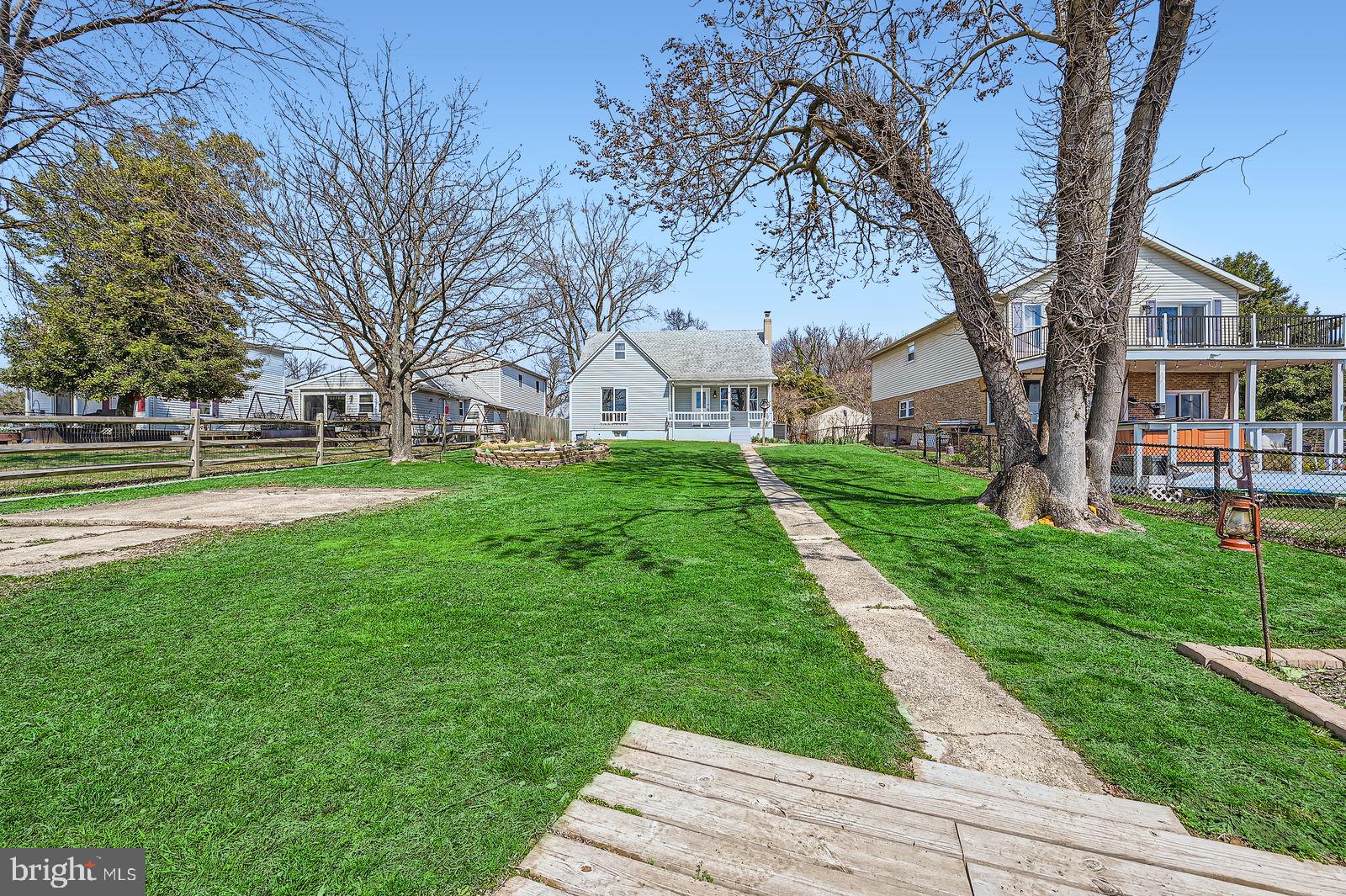 1004 Thompson Boulevard Baltimore, MD 21221 - Photo 40 of 48 a view of a house with a yard