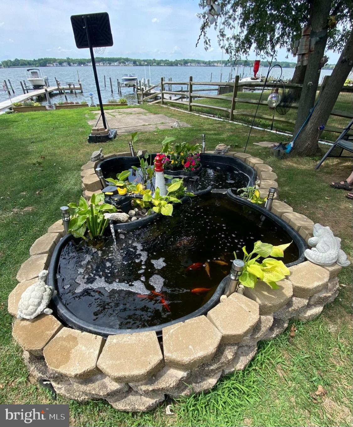 1004 Thompson Boulevard Baltimore, MD 21221 - Photo 10 of 48 a view of a swimming pool with a yard and outdoor seating