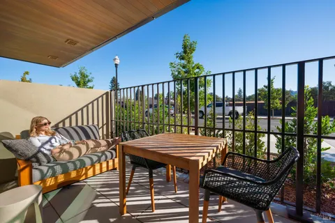 a view of a balcony with furniture