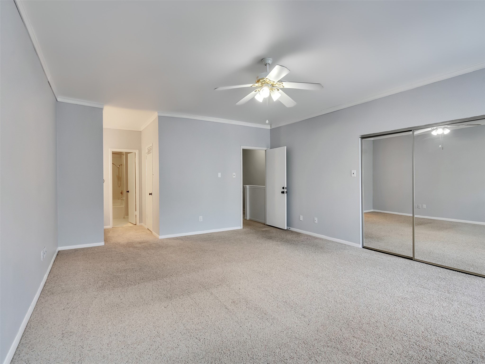 4001 Tanglewilde Street, Unit 605 Houston, TX 77063 - Photo 19 of 29 an empty room with closet and a ceiling fan