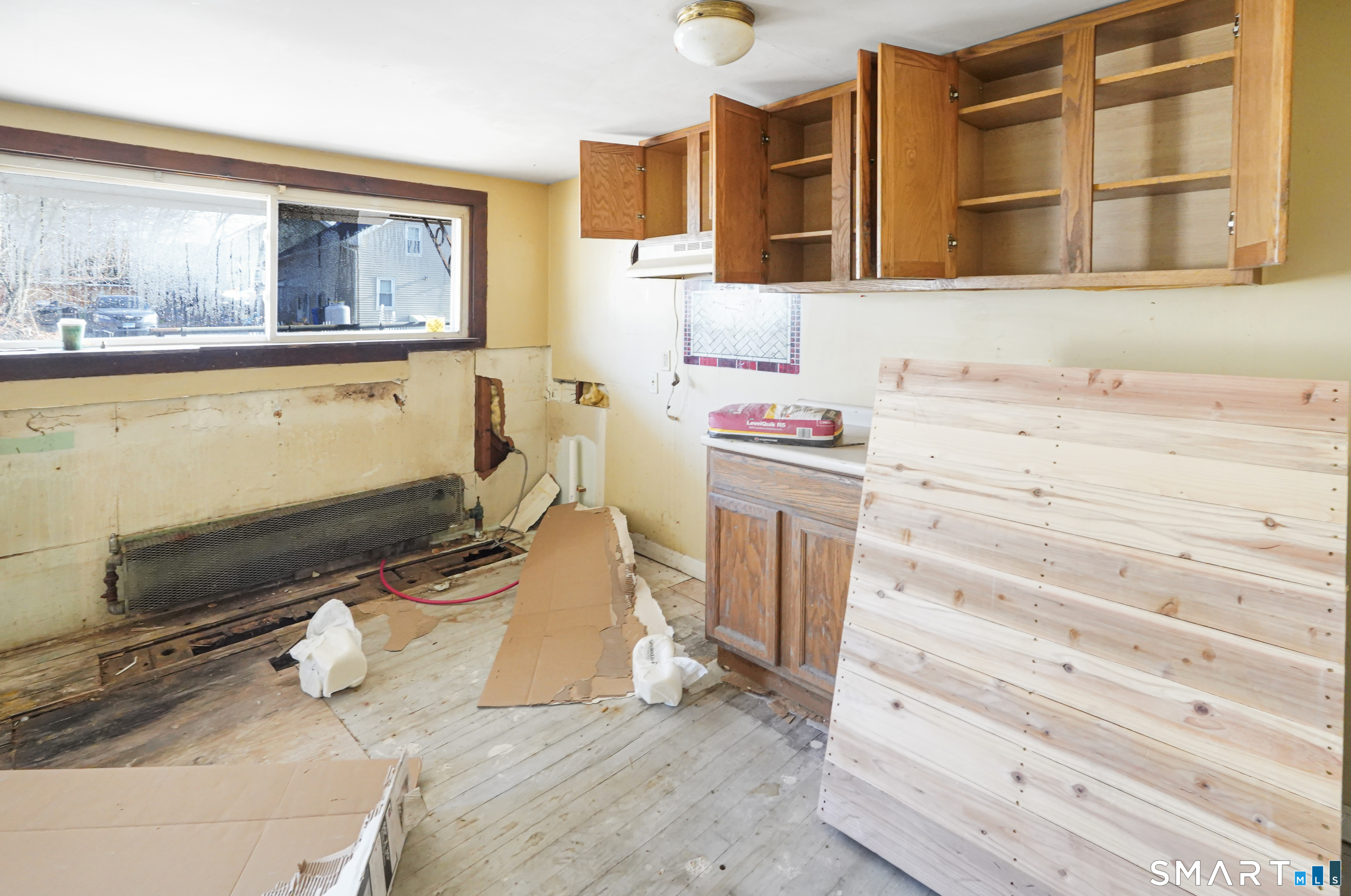 385 Putnam Pike Killingly, CT 06241 - Photo 11 of 40 a bathroom with a sink and a mirror