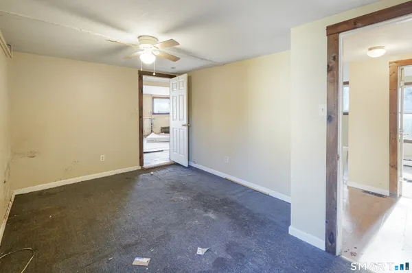 a view of an empty room and a window