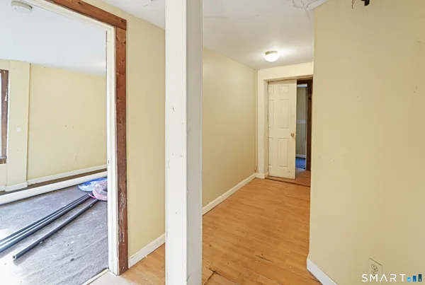 a view of hallway with a large mirror