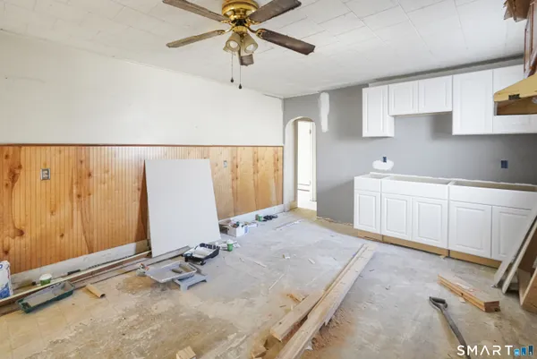 a view of a kitchen with a sink and cabinets