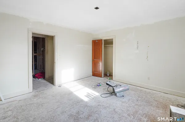 a bathroom with a tub sink and a window