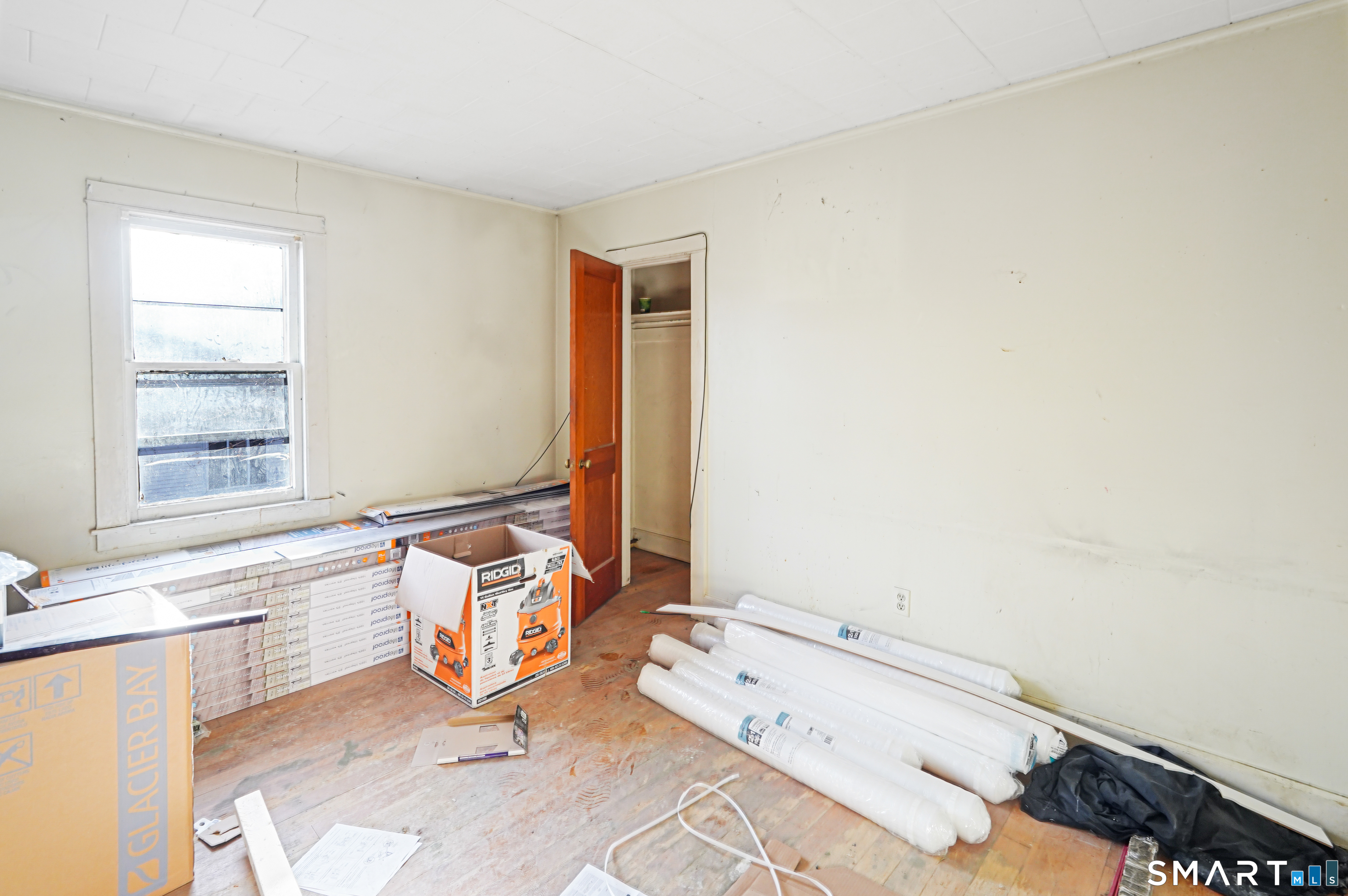 385 Putnam Pike Killingly, CT 06241 - Photo 38 of 40 a bathroom with a tub sink and a window