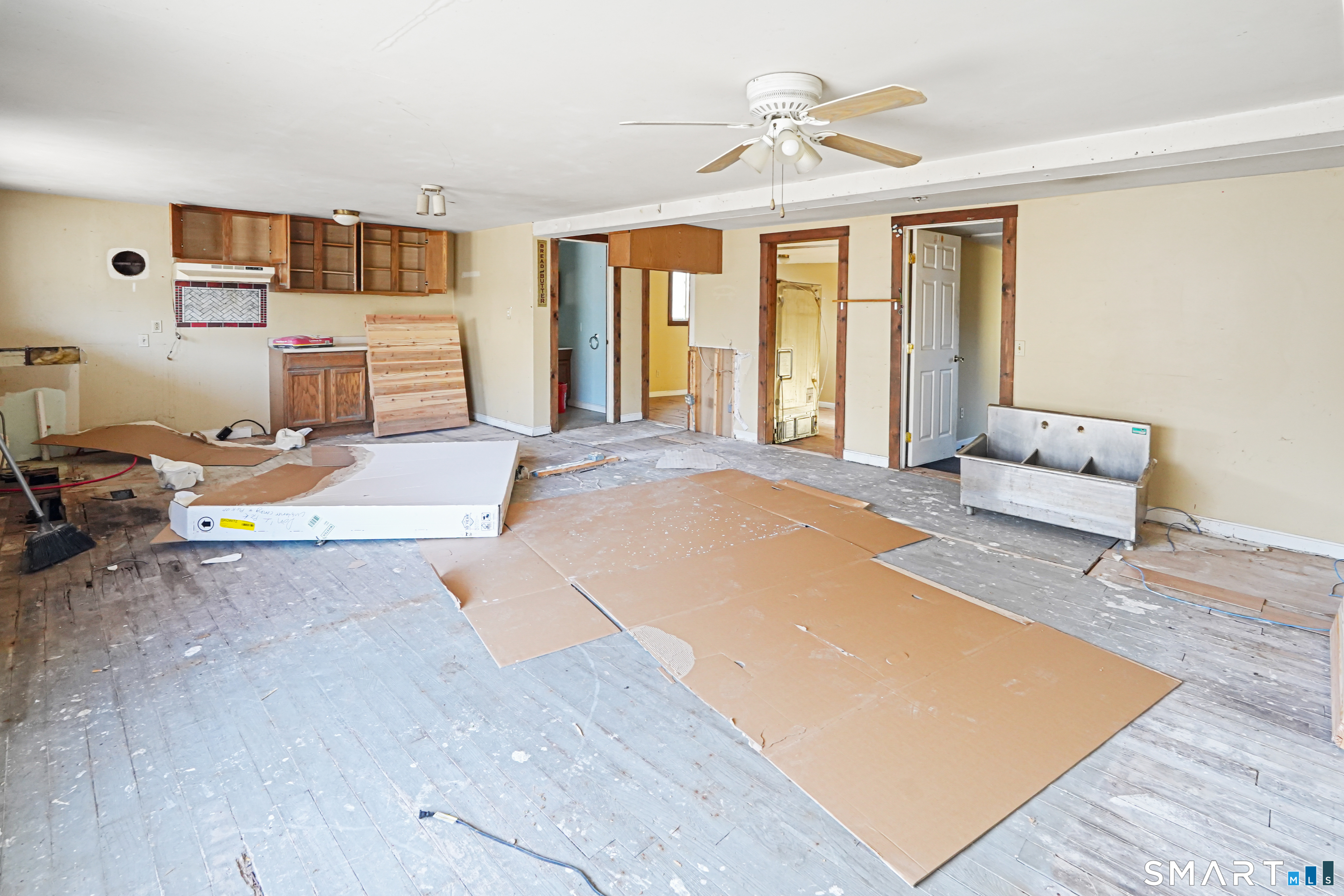 385 Putnam Pike Killingly, CT 06241 - Photo 8 of 40 a spacious bedroom with a bed and wooden floor