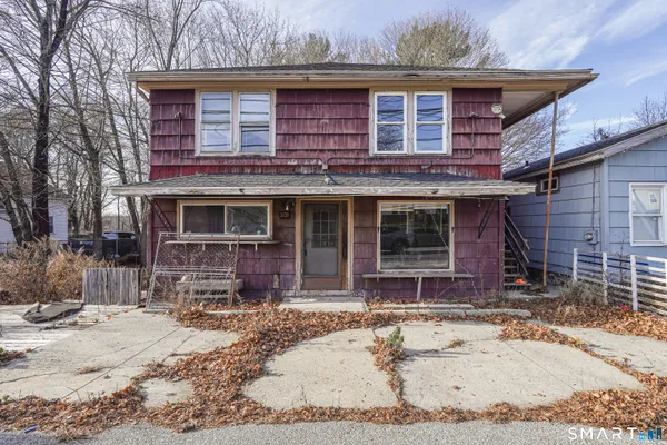 a front view of a house with outdoor space
