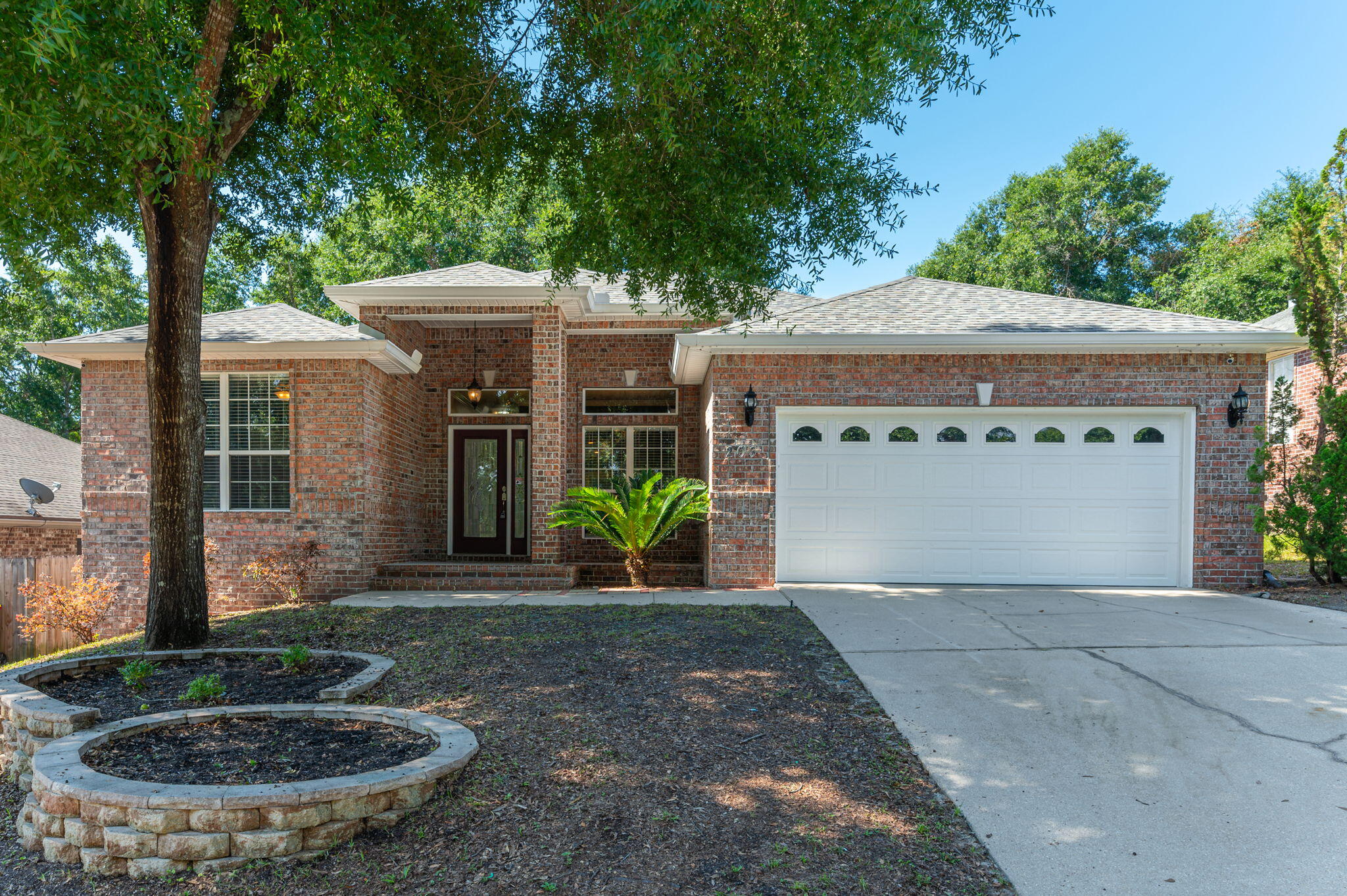 203 Eleases Crossing Crestview, FL 32539 - Photo 1 of 35 a view of a house with porch and garden