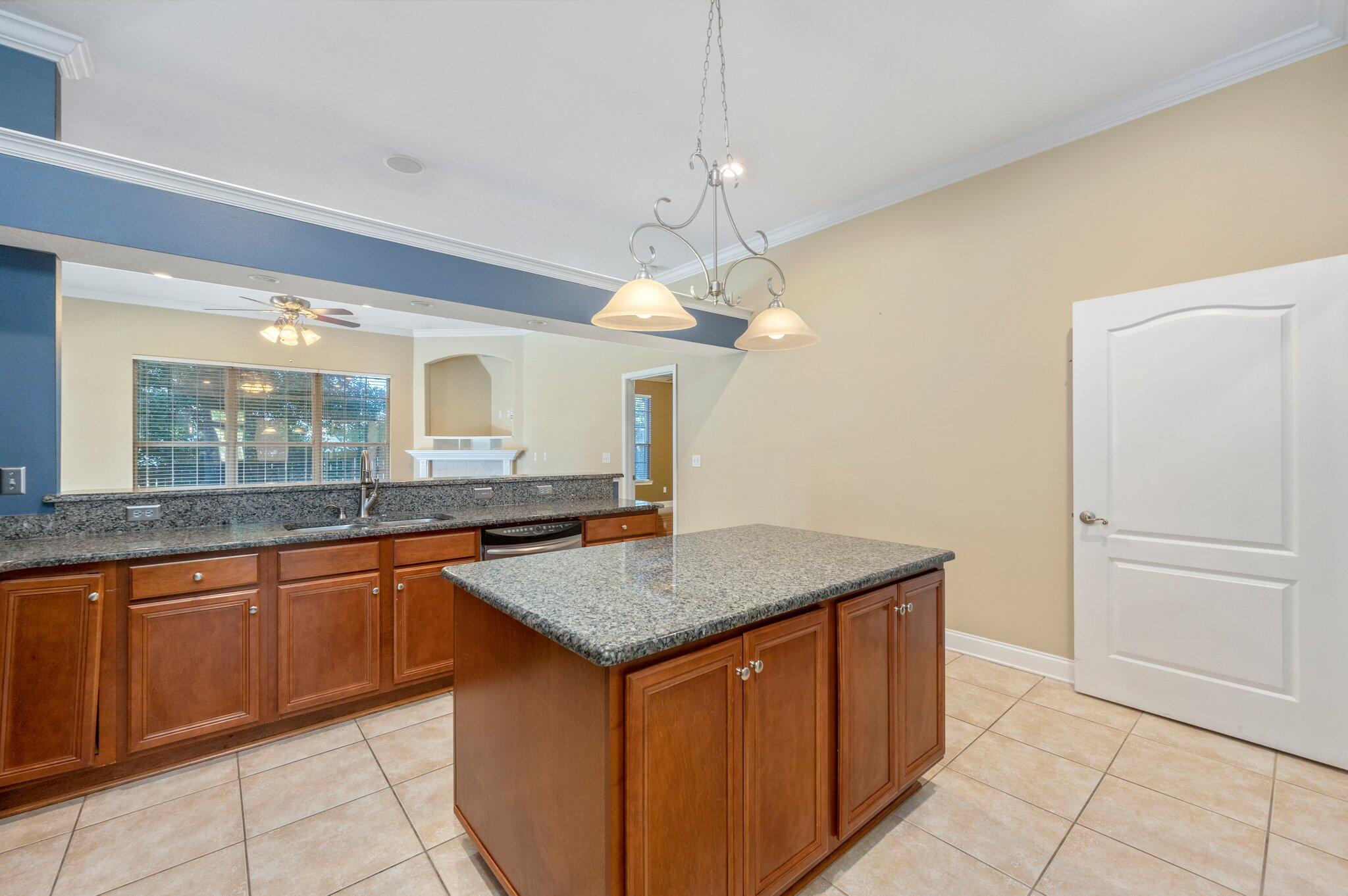203 Eleases Crossing Crestview, FL 32539 - Photo 13 of 35 a kitchen with a counter top space appliances and cabinets