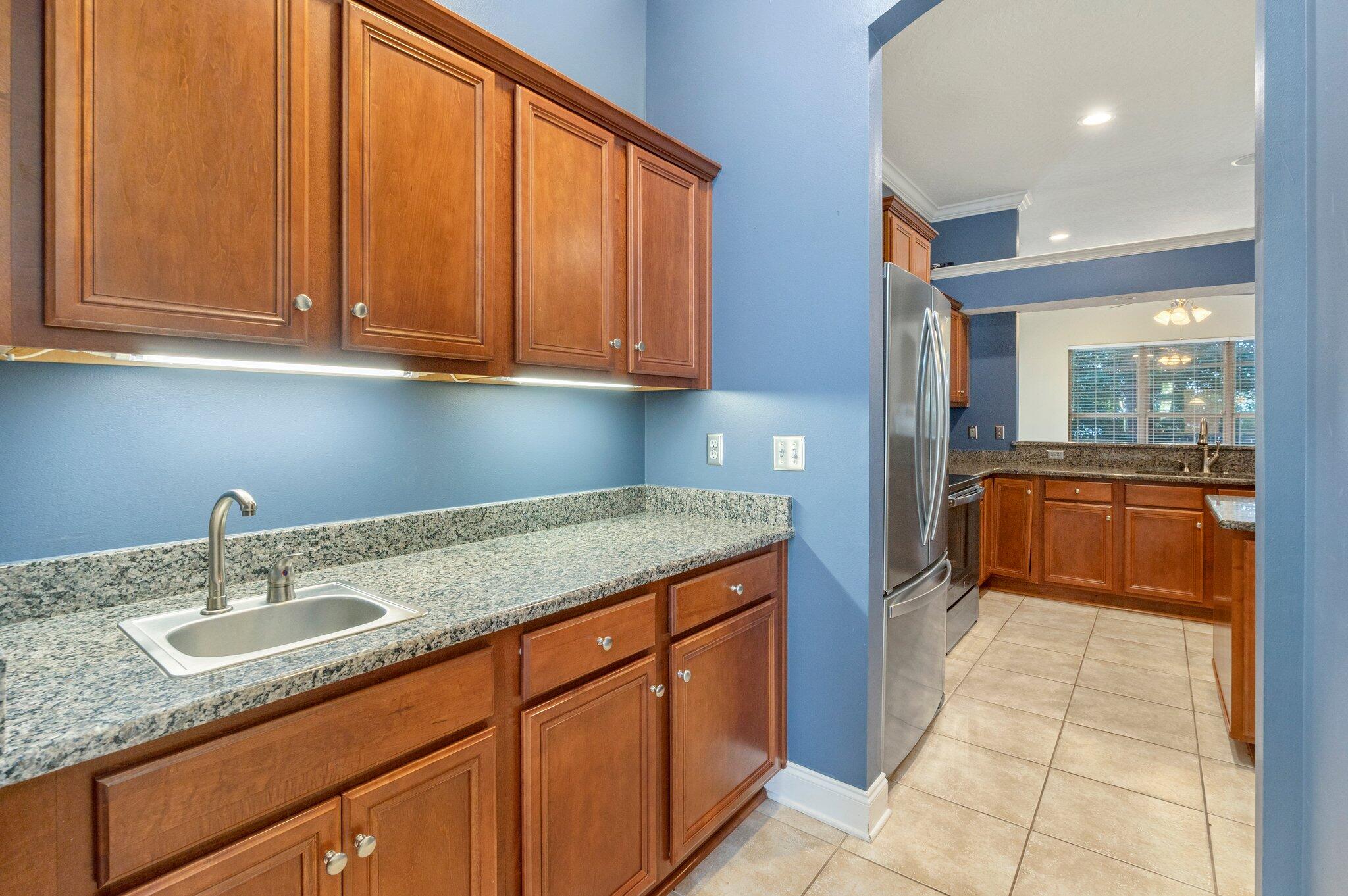203 Eleases Crossing Crestview, FL 32539 - Photo 14 of 35 a kitchen with a sink and cabinets