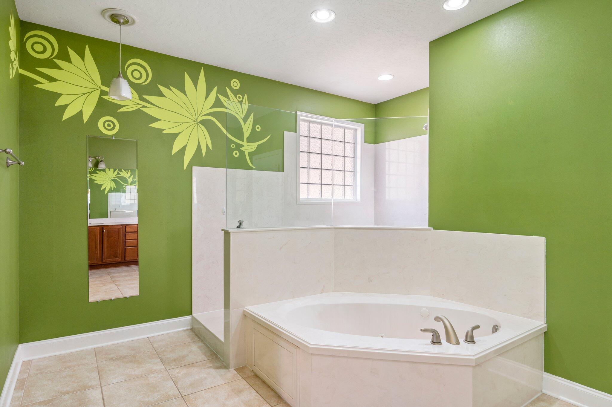 203 Eleases Crossing Crestview, FL 32539 - Photo 19 of 35 a bathroom with a bathtub and a shower