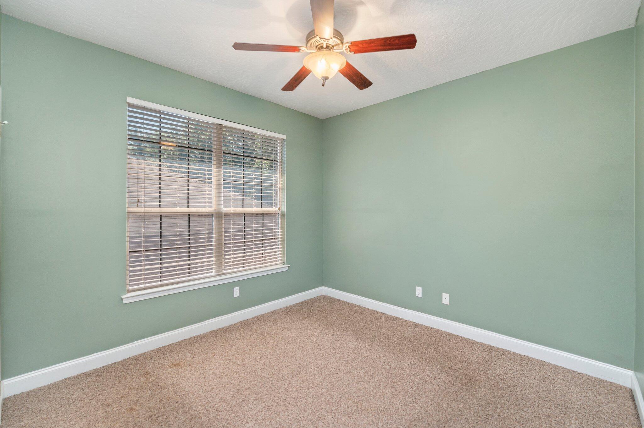 203 Eleases Crossing Crestview, FL 32539 - Photo 26 of 35 an empty room with a window and a fan