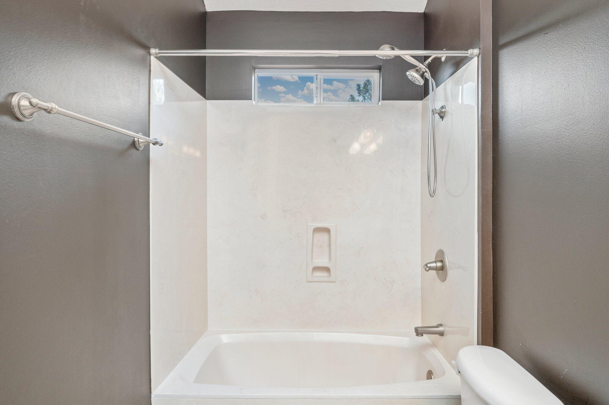 203 Eleases Crossing Crestview, FL 32539 - Photo 29 of 35 a bathroom with a bathtub and a shower