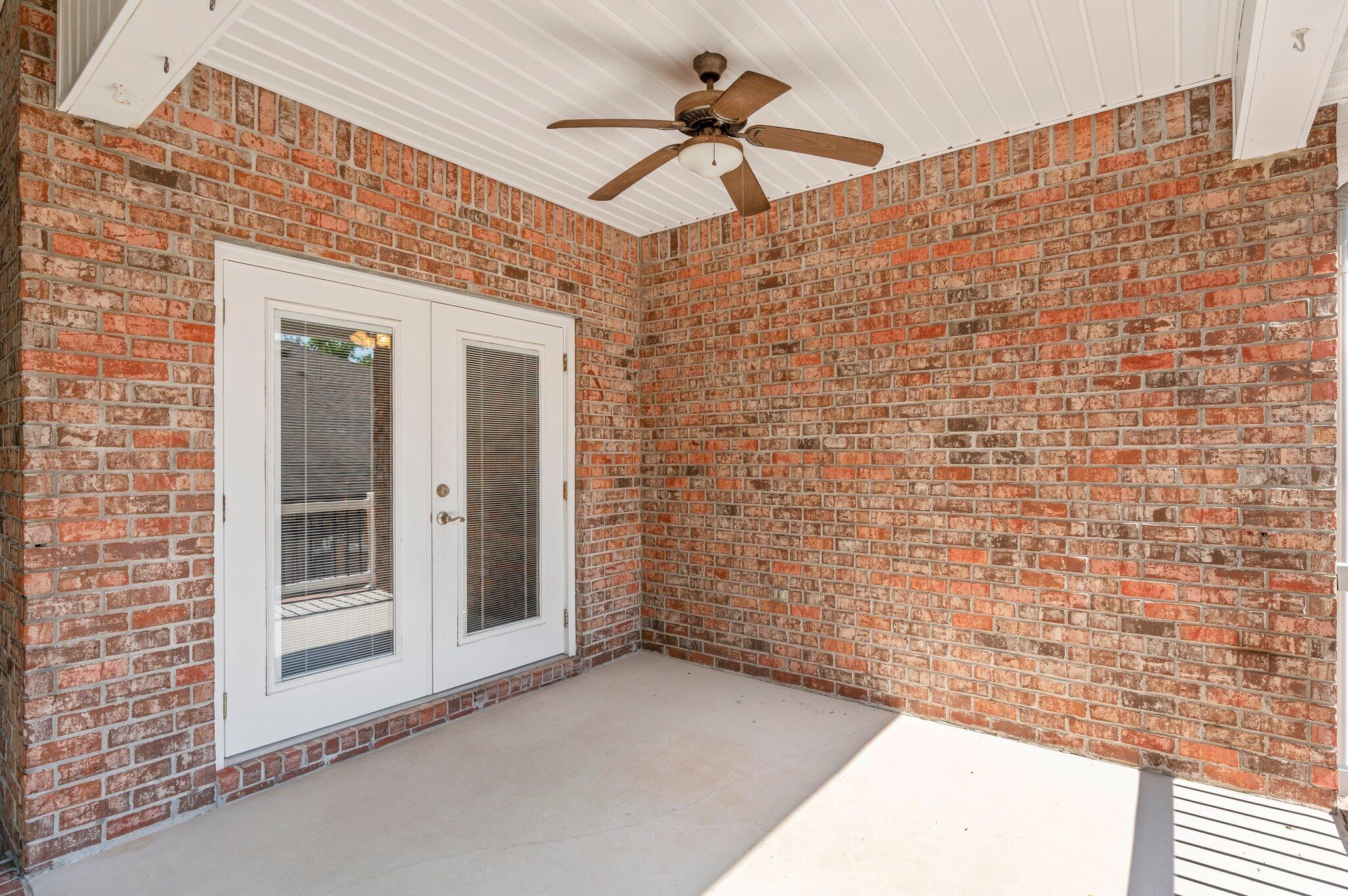 203 Eleases Crossing Crestview, FL 32539 - Photo 32 of 35 a view of a wooden door and a ceiling fan