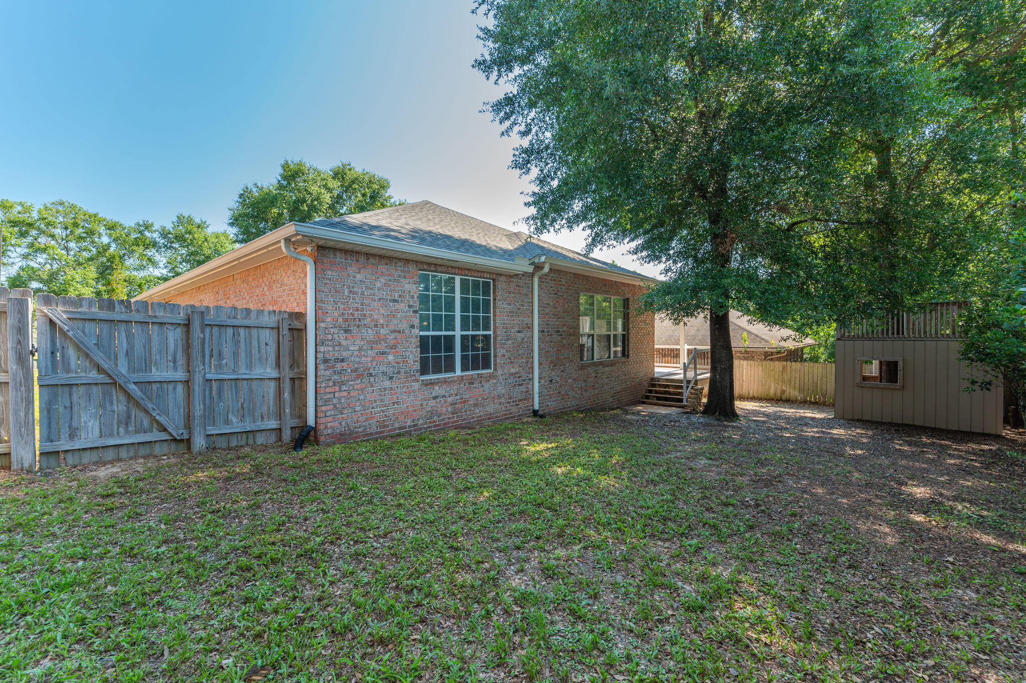 203 Eleases Crossing Crestview, FL 32539 - Photo 33 of 35 a view of a house with a yard and a large tree