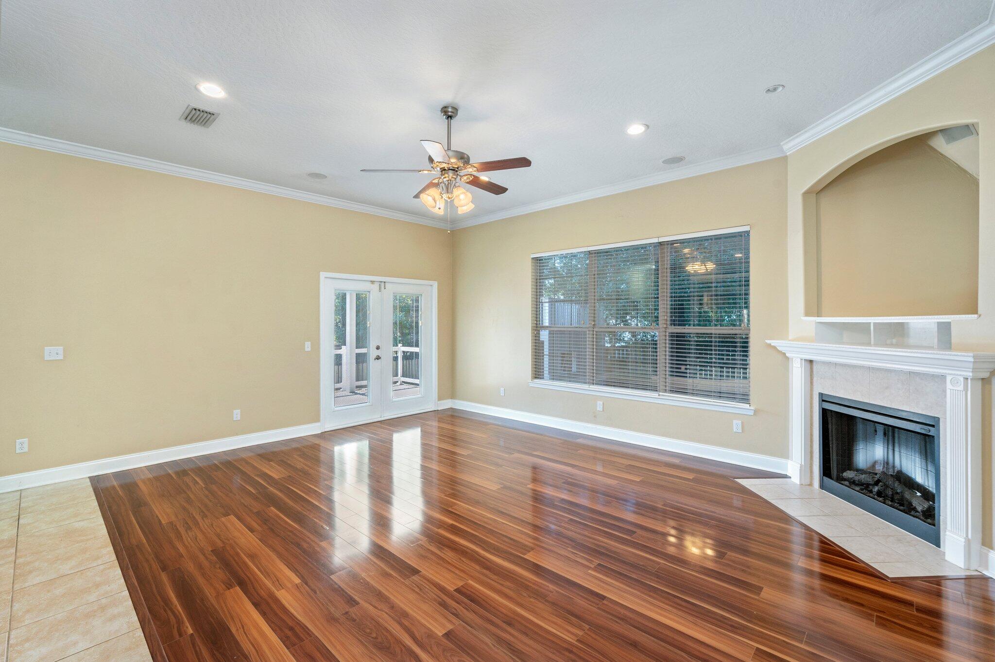 203 Eleases Crossing Crestview, FL 32539 - Photo 8 of 35 a view of an empty room with a fireplace and a window