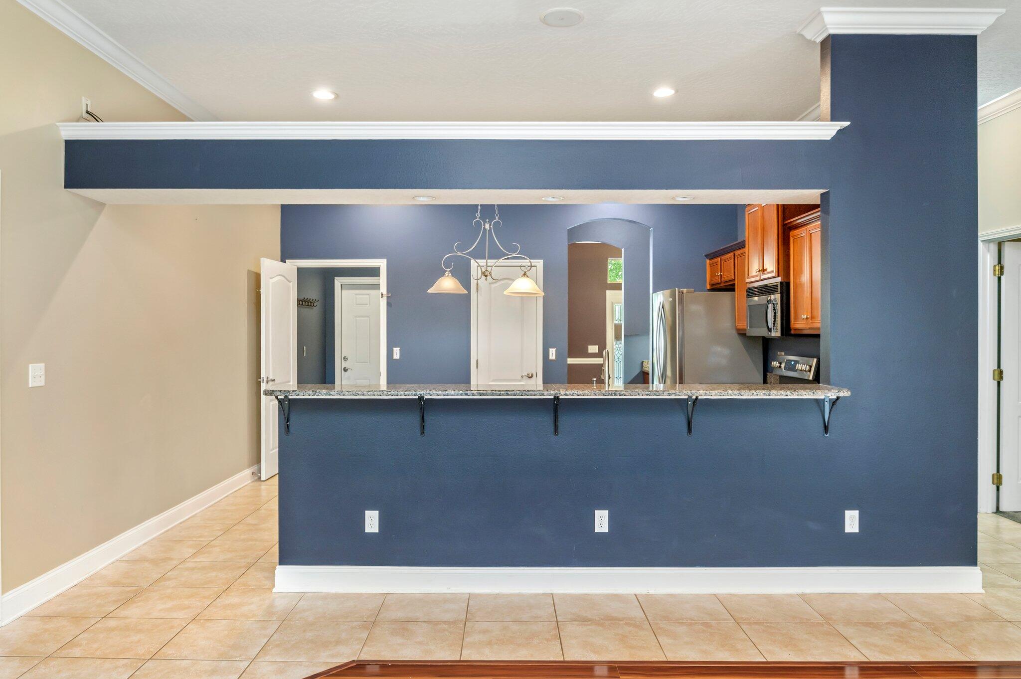 203 Eleases Crossing Crestview, FL 32539 - Photo 9 of 35 a living room with a sink and chandelier