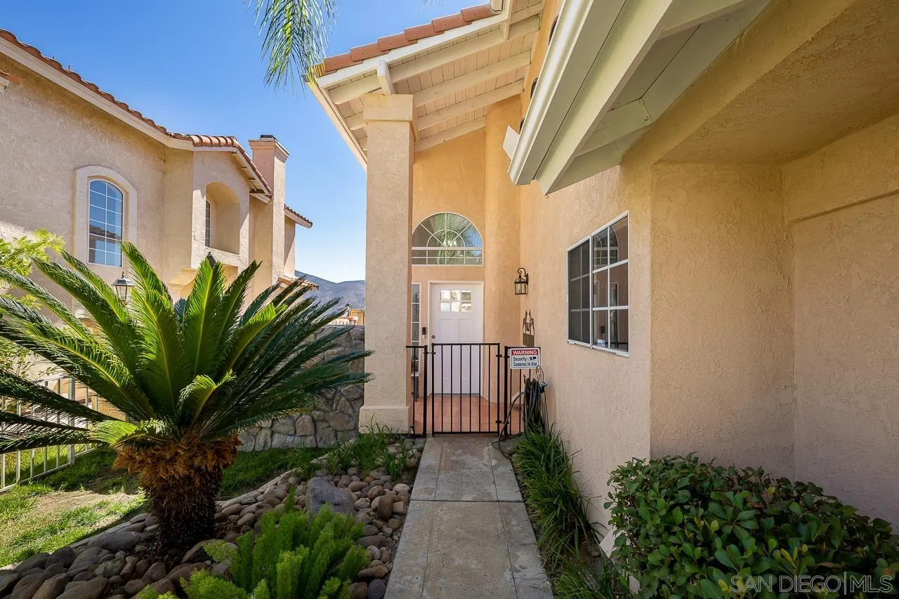 9851 Avenida Ricardo Spring Valley, CA 91977 - Photo 3 of 41 a view of a house with a small yard