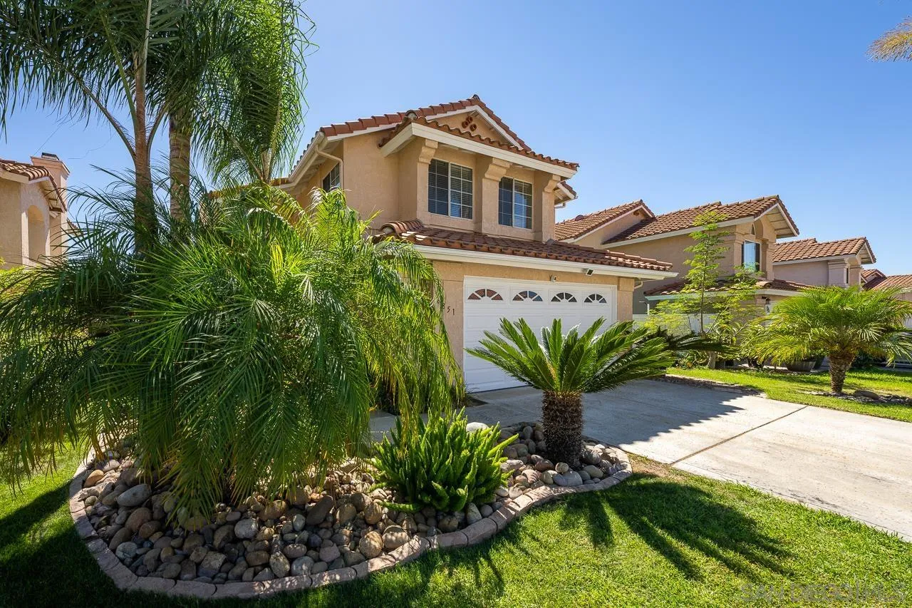 9851 Avenida Ricardo Spring Valley, CA 91977 - Photo 41 of 41 a front view of a house with a yard and garage