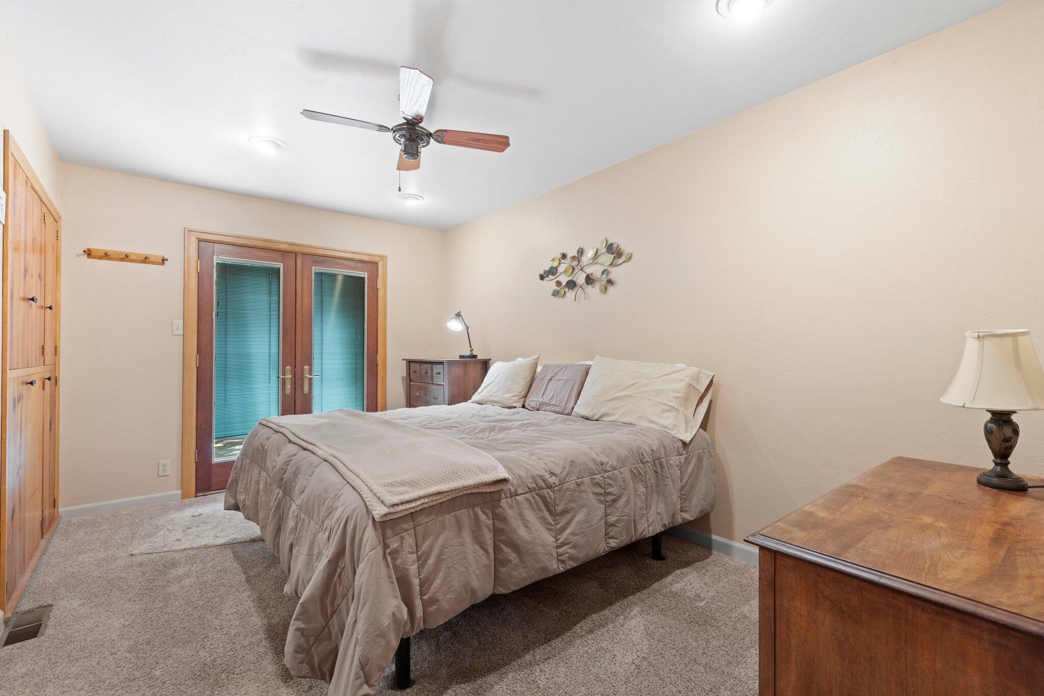 6062 Adams Road Talent, OR 97540 - Photo 18 of 75 a bedroom with a bed and a table