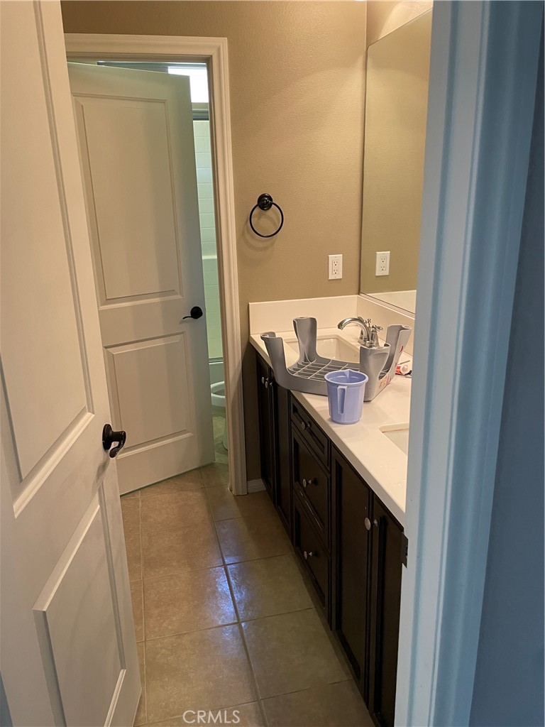 3476 Villa Drive Brea, CA 92823 - Photo 11 of 16 a bathroom with a granite countertop sink