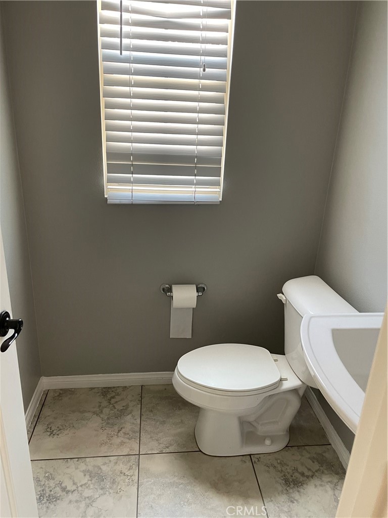 3476 Villa Drive Brea, CA 92823 - Photo 13 of 16 a white toilet sitting next to a bathroom sink