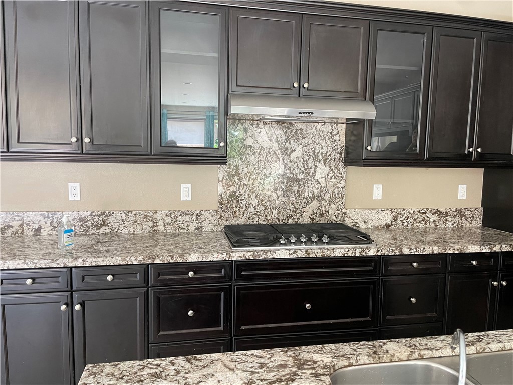 3476 Villa Drive Brea, CA 92823 - Photo 2 of 16 a kitchen with granite countertop a stove and cabinets