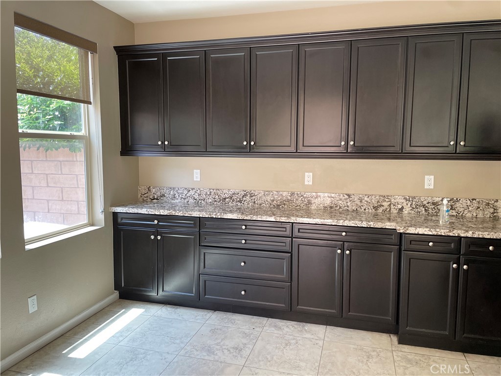 3476 Villa Drive Brea, CA 92823 - Photo 3 of 16 a kitchen with granite countertop cabinets and window