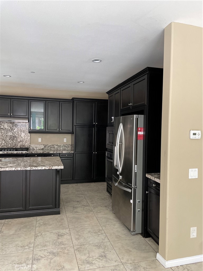 3476 Villa Drive Brea, CA 92823 - Photo 4 of 16 a kitchen with stainless steel appliances granite countertop a refrigerator and a stove