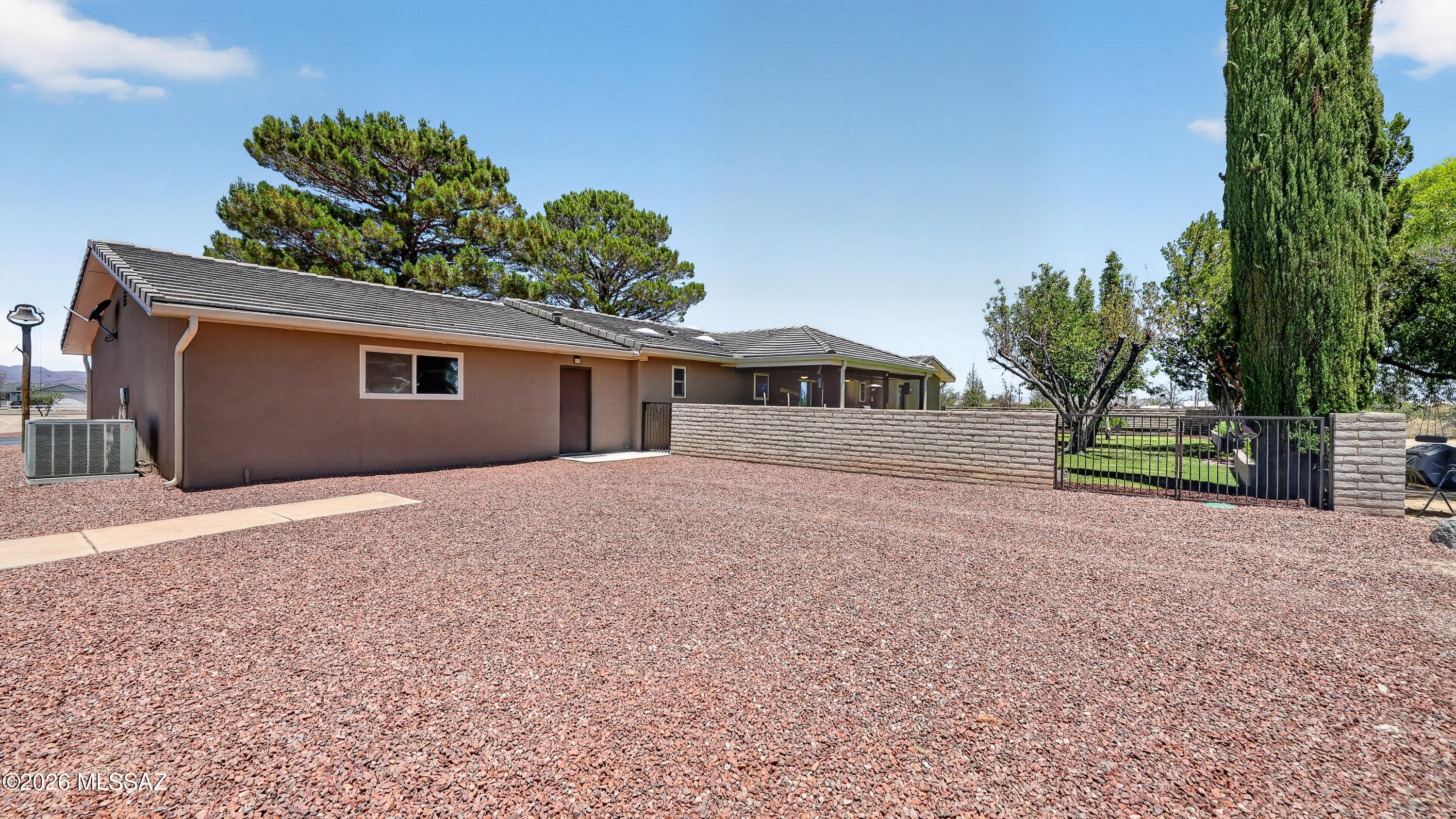 194 Taylor Road Willcox, AZ 85643 - Photo 36 of 54 The rear exterior has been freshly graveled, offering a clean, low-maintenance space with ample room for parking, access, and everyday use.