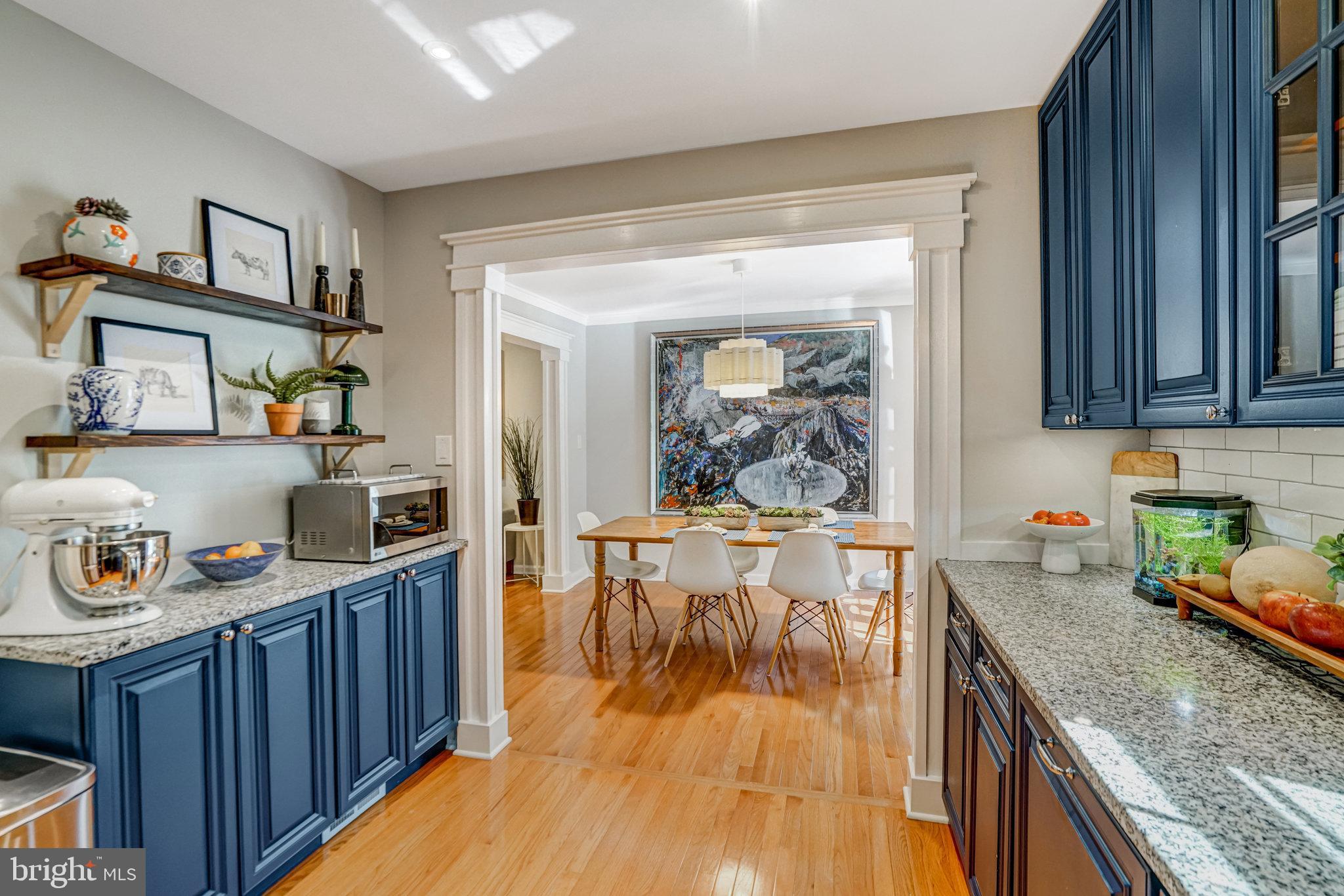 7923 Forest Path Way Springfield, VA 22153 - Photo 12 of 39 a kitchen with granite countertop lots of counter top space and wooden floor