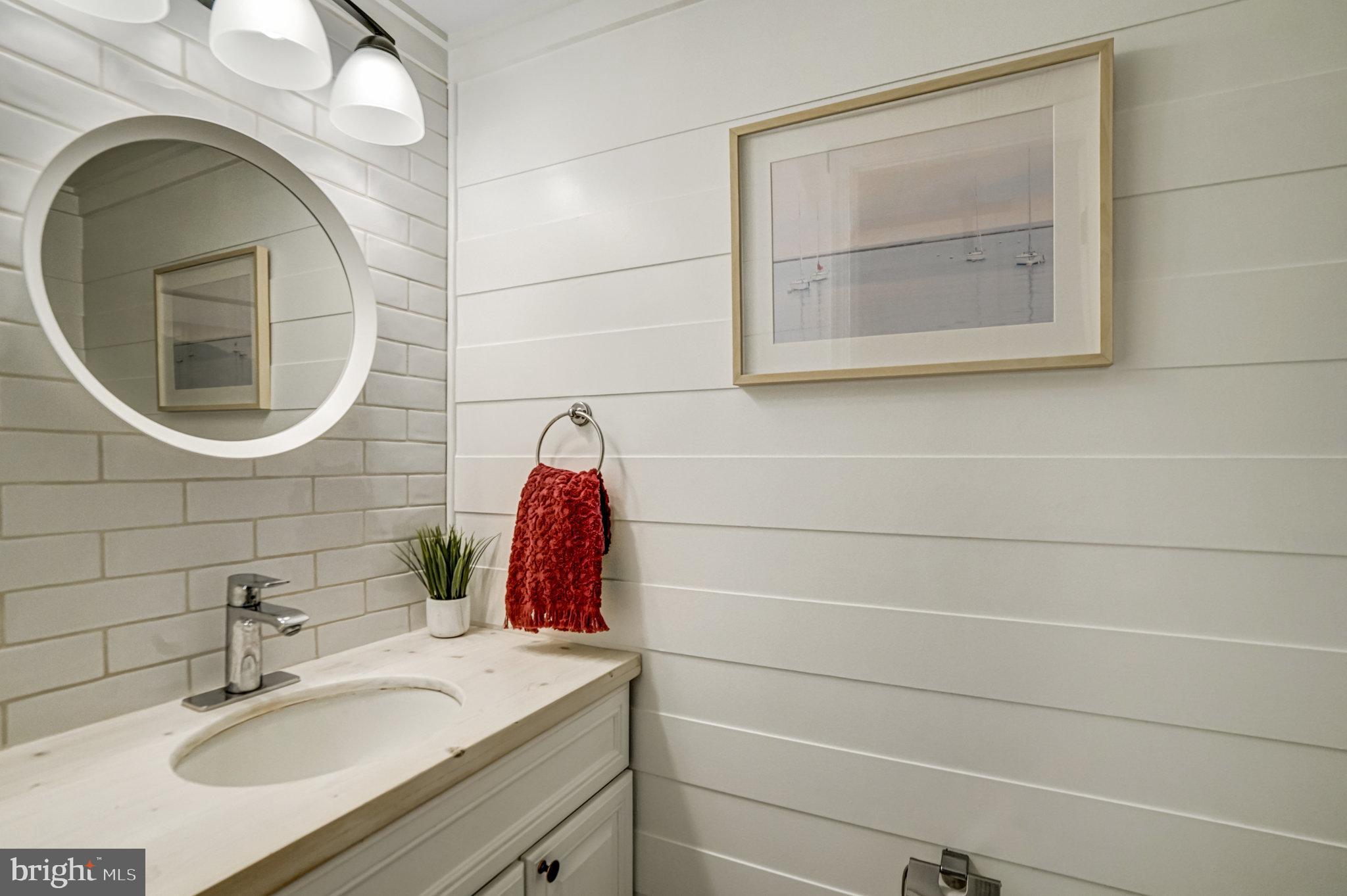 7923 Forest Path Way Springfield, VA 22153 - Photo 14 of 39 a bathroom with a sink and a mirror