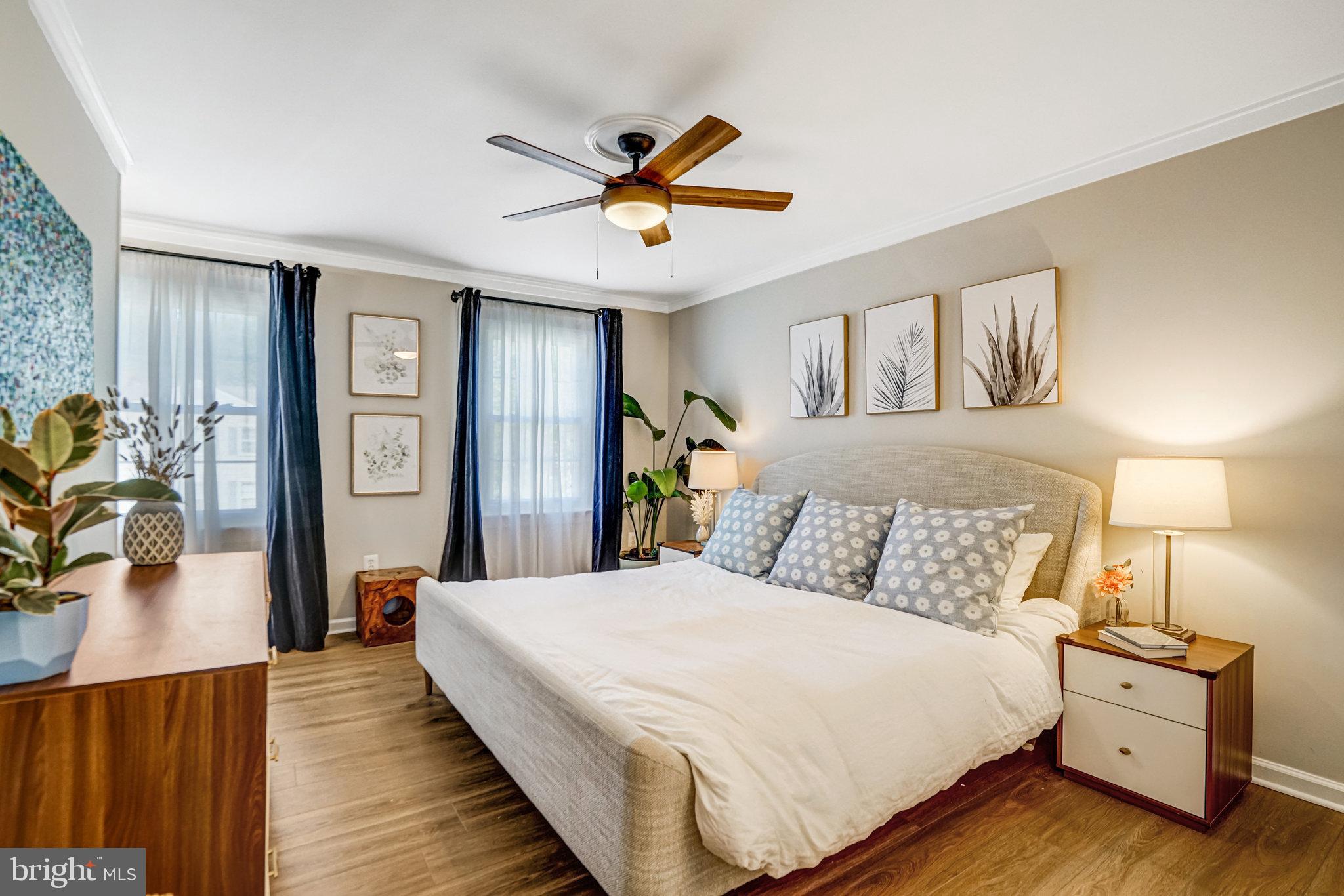 7923 Forest Path Way Springfield, VA 22153 - Photo 15 of 39 a bedroom with a bed and wooden floor