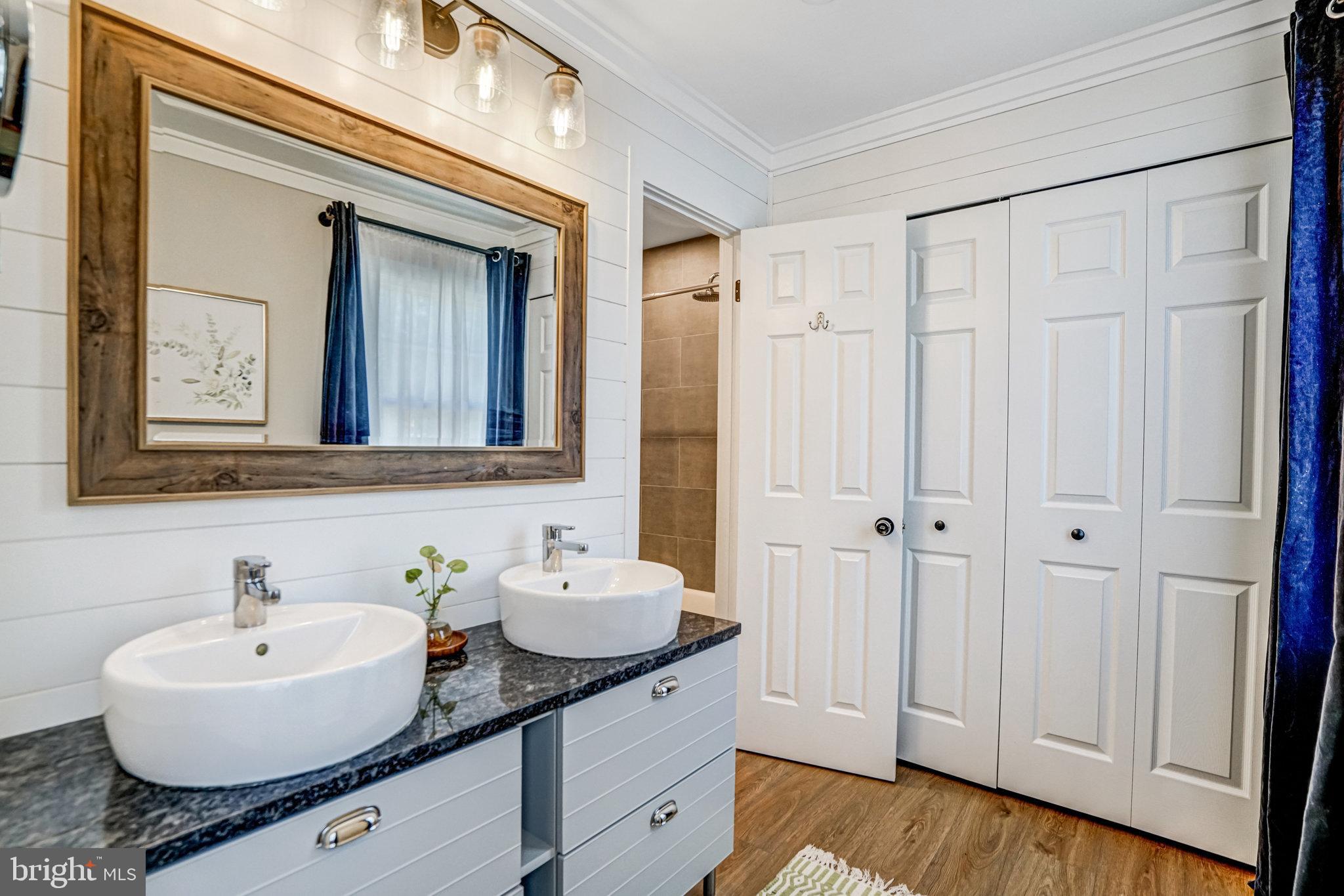 7923 Forest Path Way Springfield, VA 22153 - Photo 18 of 39 a bathroom with a granite countertop sink and a mirror