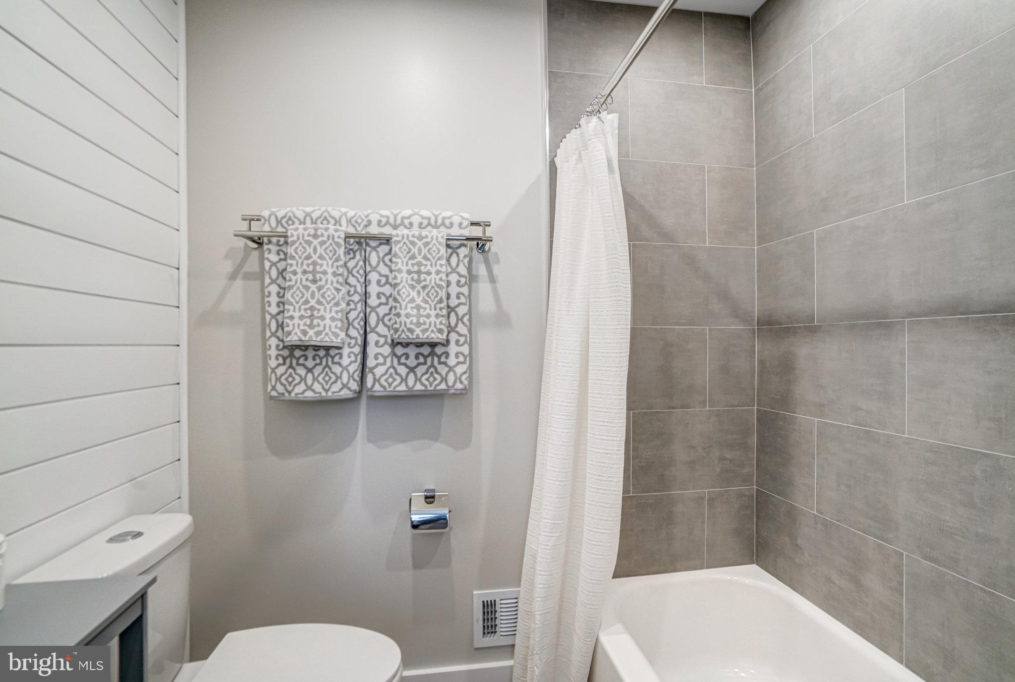 7923 Forest Path Way Springfield, VA 22153 - Photo 20 of 39 a bathroom with a toilet and a shower