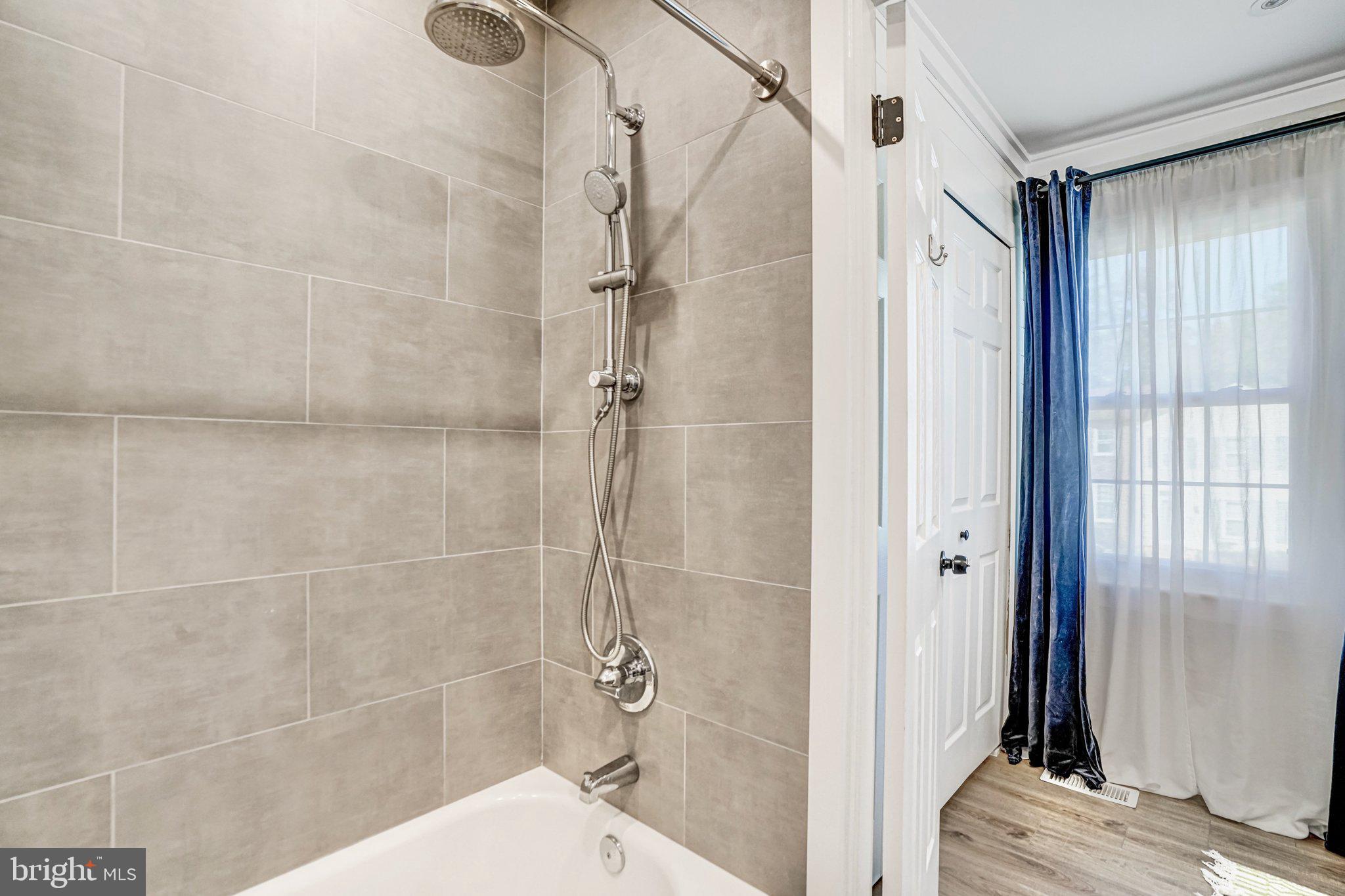 7923 Forest Path Way Springfield, VA 22153 - Photo 21 of 39 a bathroom with a shower and a toilet