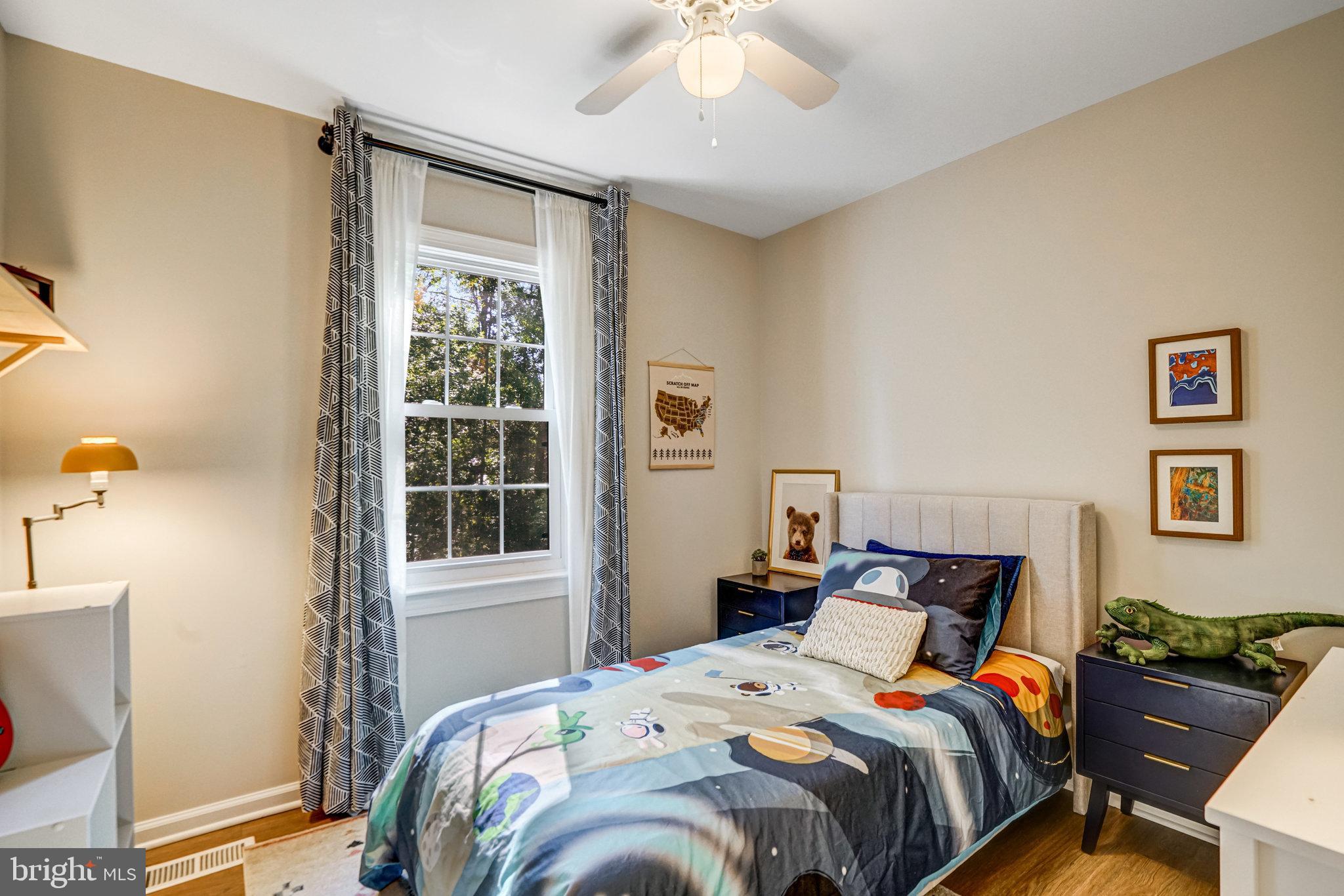 7923 Forest Path Way Springfield, VA 22153 - Photo 22 of 39 a bedroom with a bed and a window