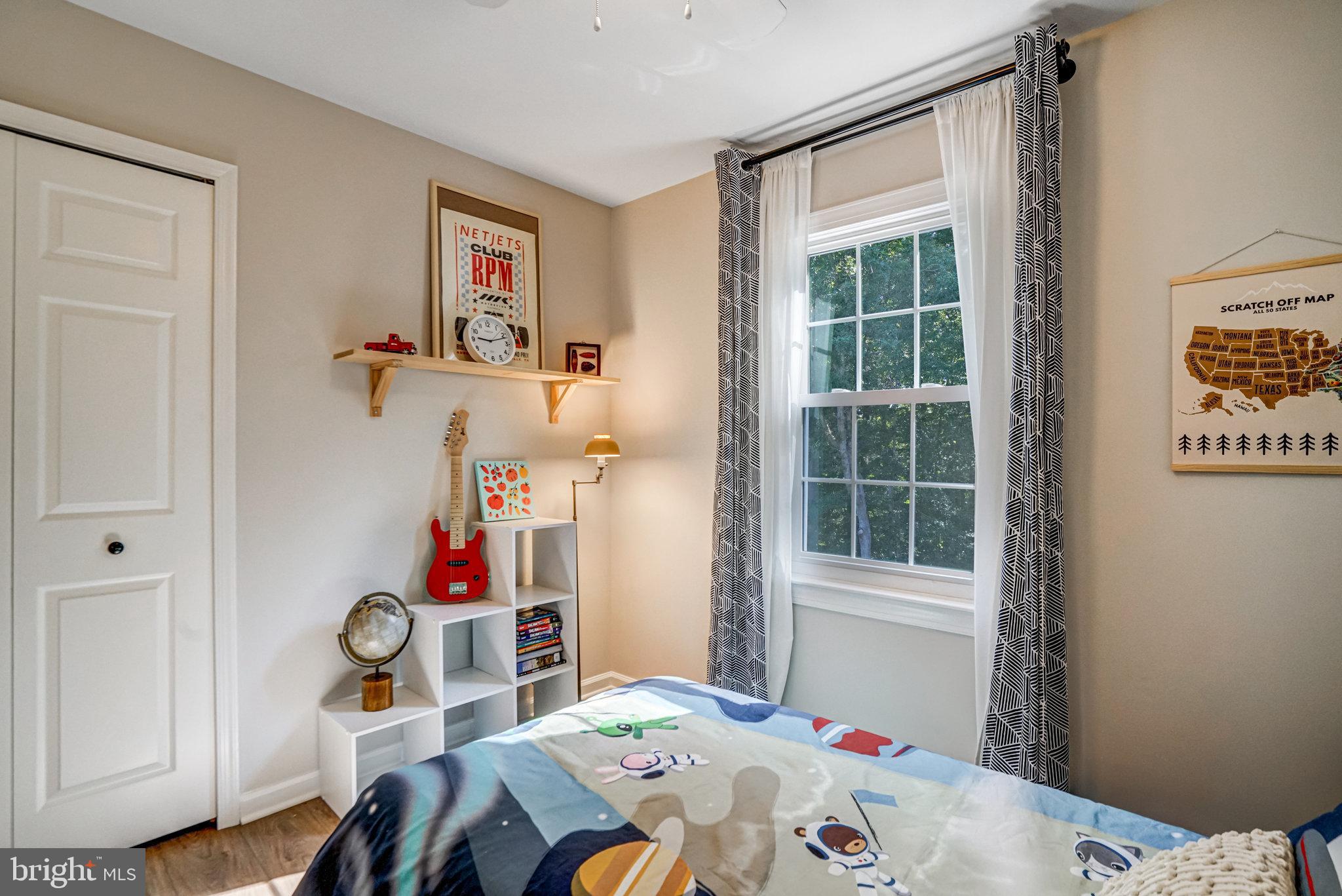 7923 Forest Path Way Springfield, VA 22153 - Photo 23 of 39 a bedroom with a bed and a window