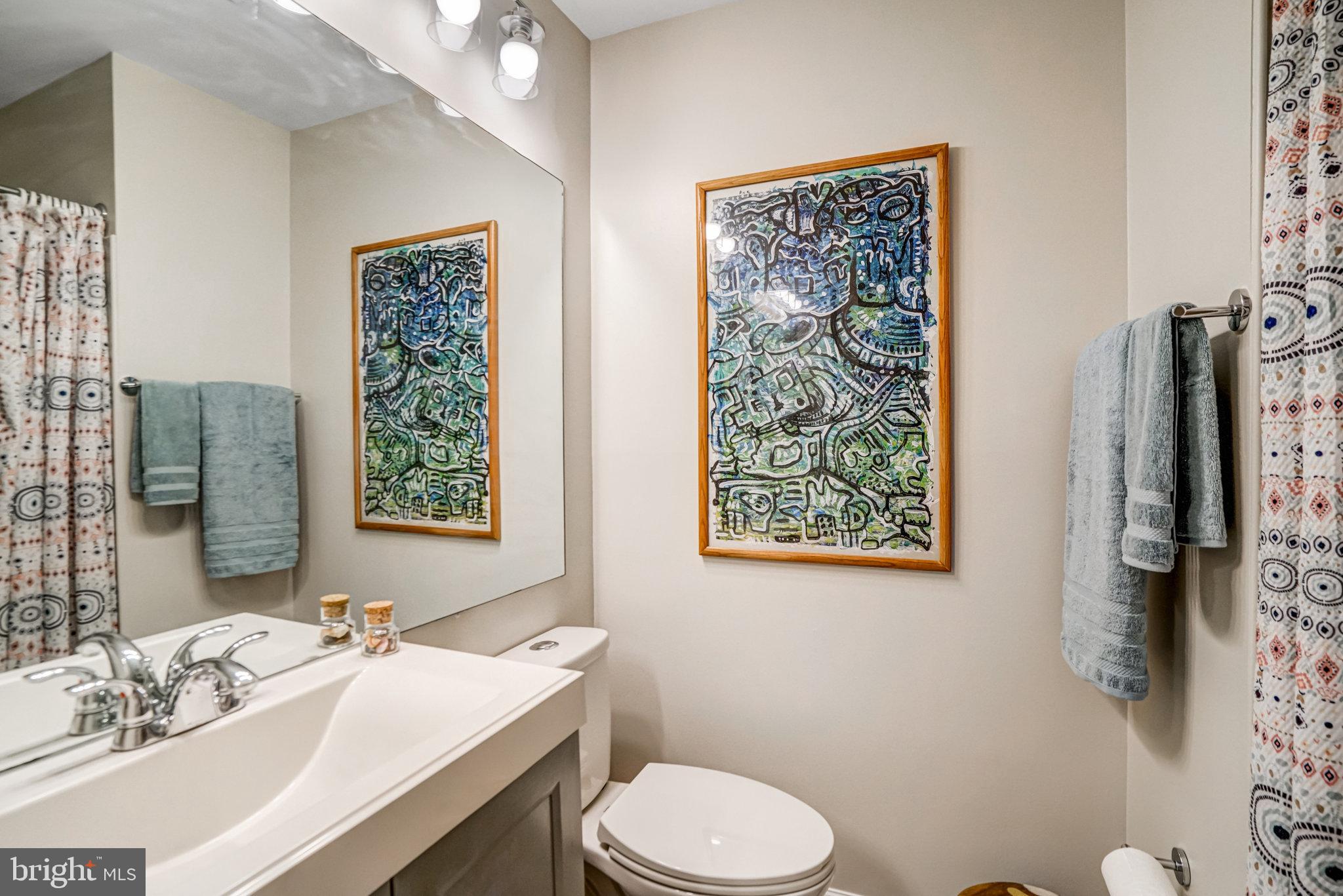7923 Forest Path Way Springfield, VA 22153 - Photo 27 of 39 a bathroom with a sink a toilet and shower