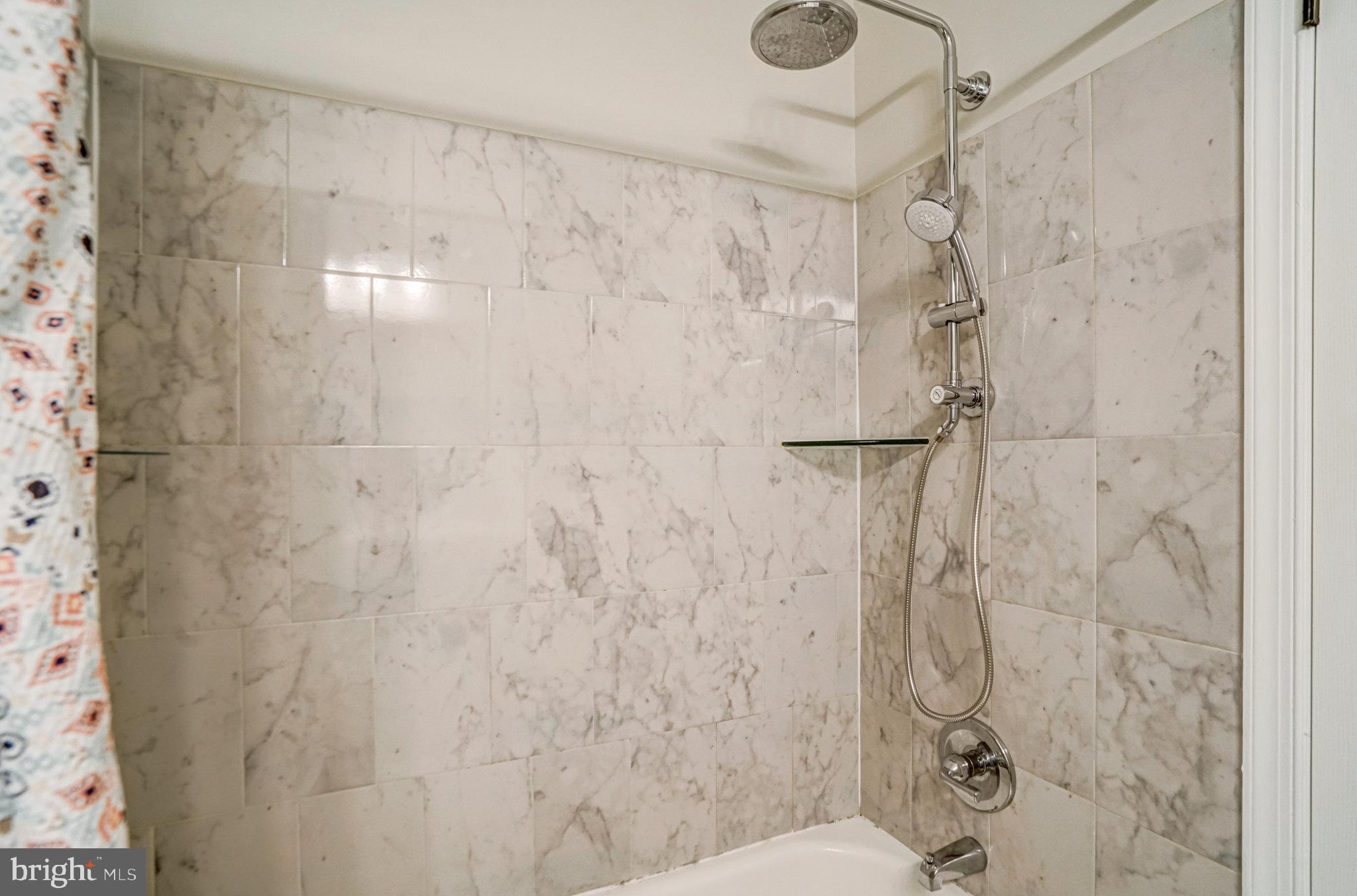 7923 Forest Path Way Springfield, VA 22153 - Photo 28 of 39 a bathroom with a shower toilet and sink
