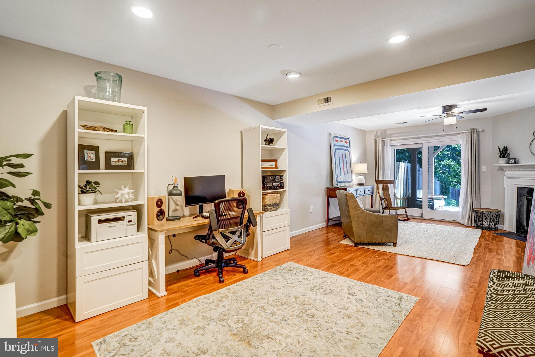 7923 Forest Path Way Springfield, VA 22153 - Photo 29 of 39 a living room with furniture a rug and a flat screen tv