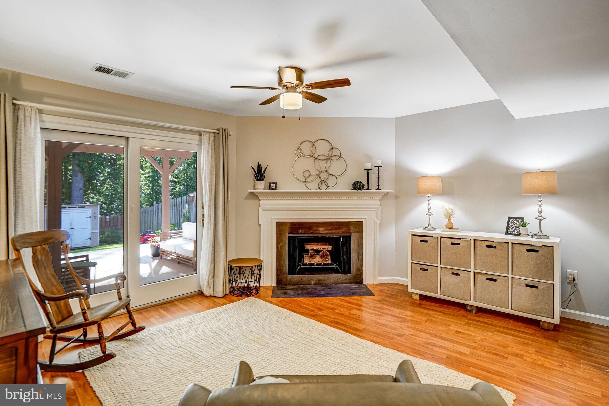 7923 Forest Path Way Springfield, VA 22153 - Photo 31 of 39 a living room with furniture and a fireplace
