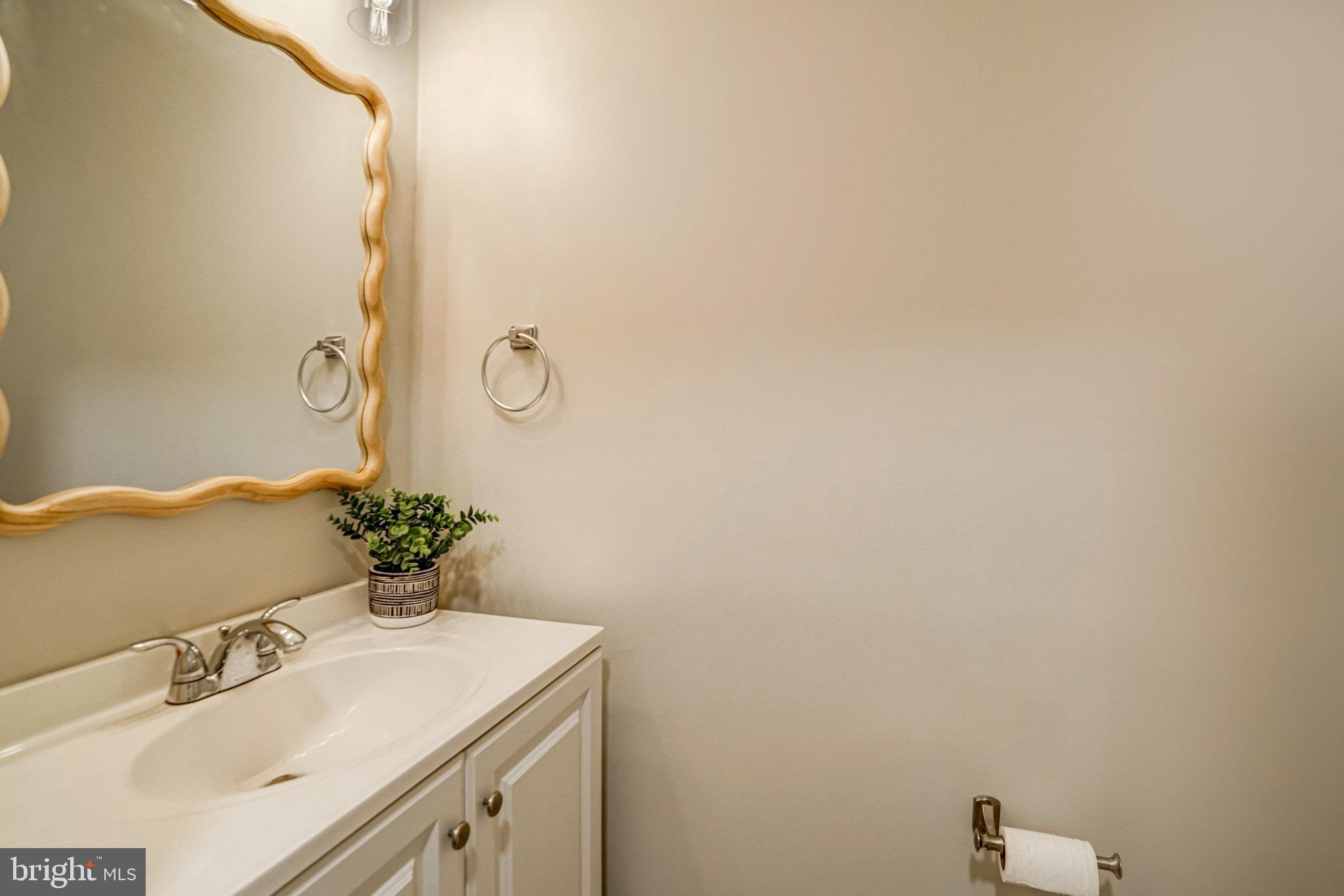 7923 Forest Path Way Springfield, VA 22153 - Photo 32 of 39 a bathroom with a sink vanity and a mirror