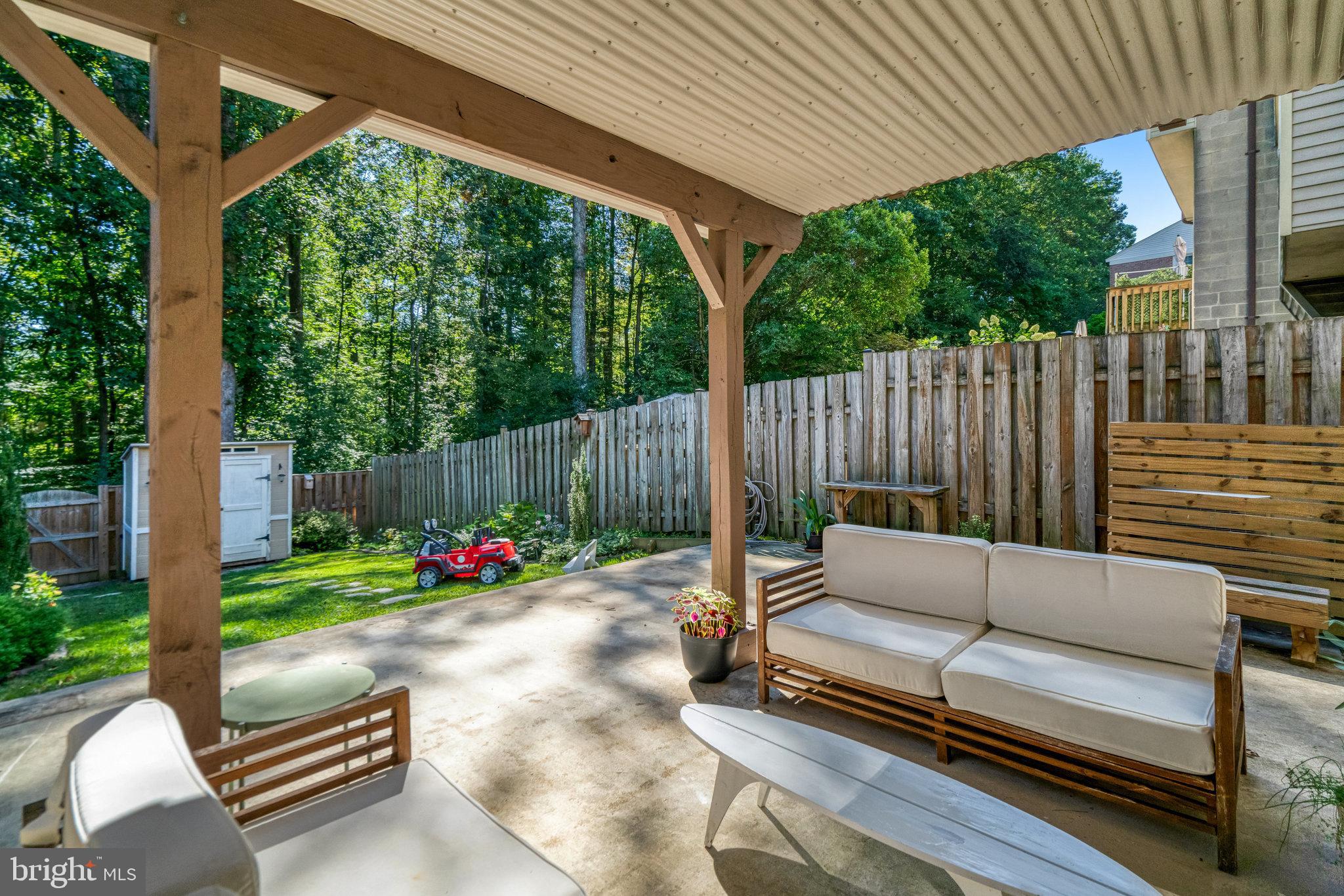 7923 Forest Path Way Springfield, VA 22153 - Photo 33 of 39 a backyard of a house with table and chairs