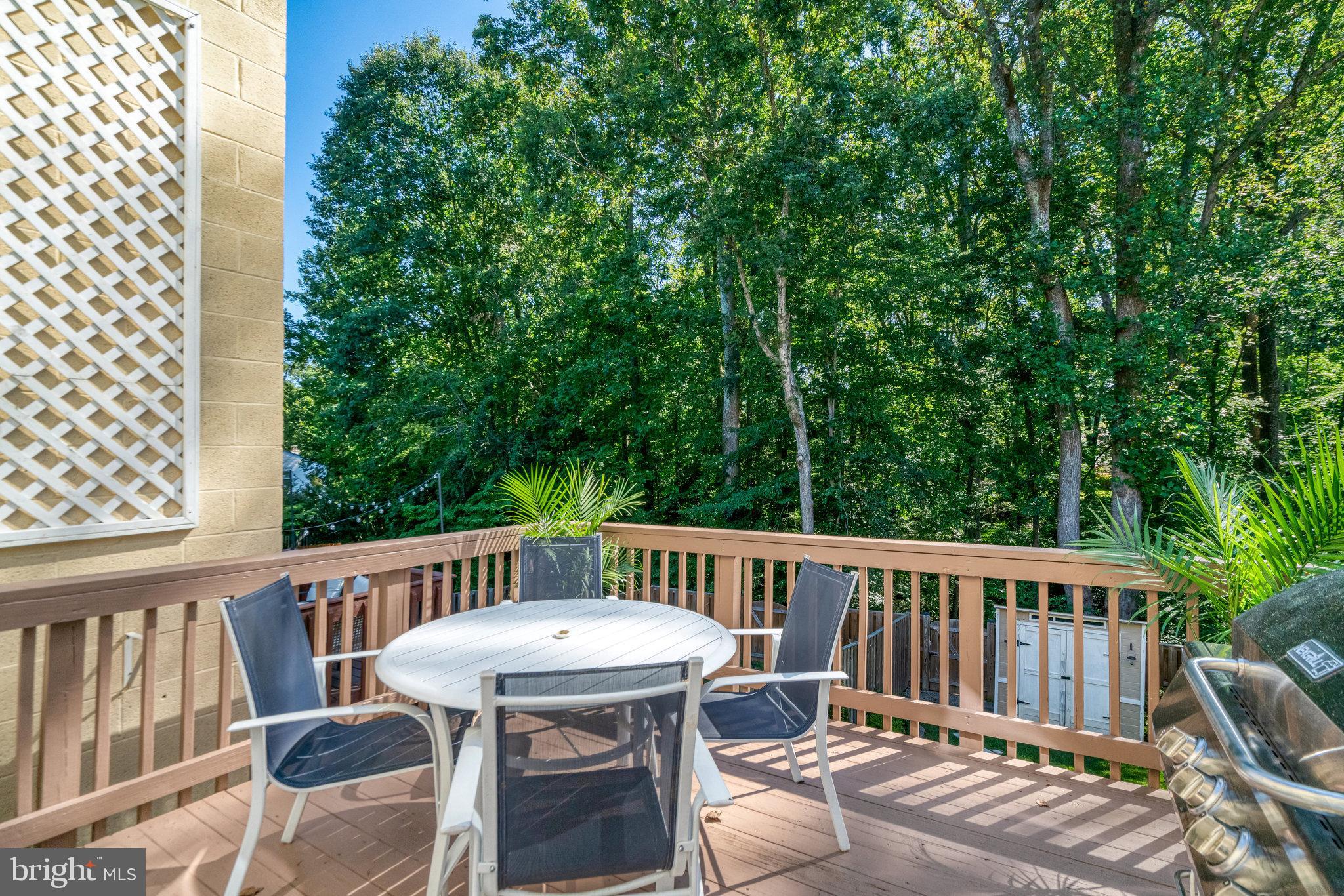 7923 Forest Path Way Springfield, VA 22153 - Photo 7 of 39 a view of a deck patio and outdoor seating
